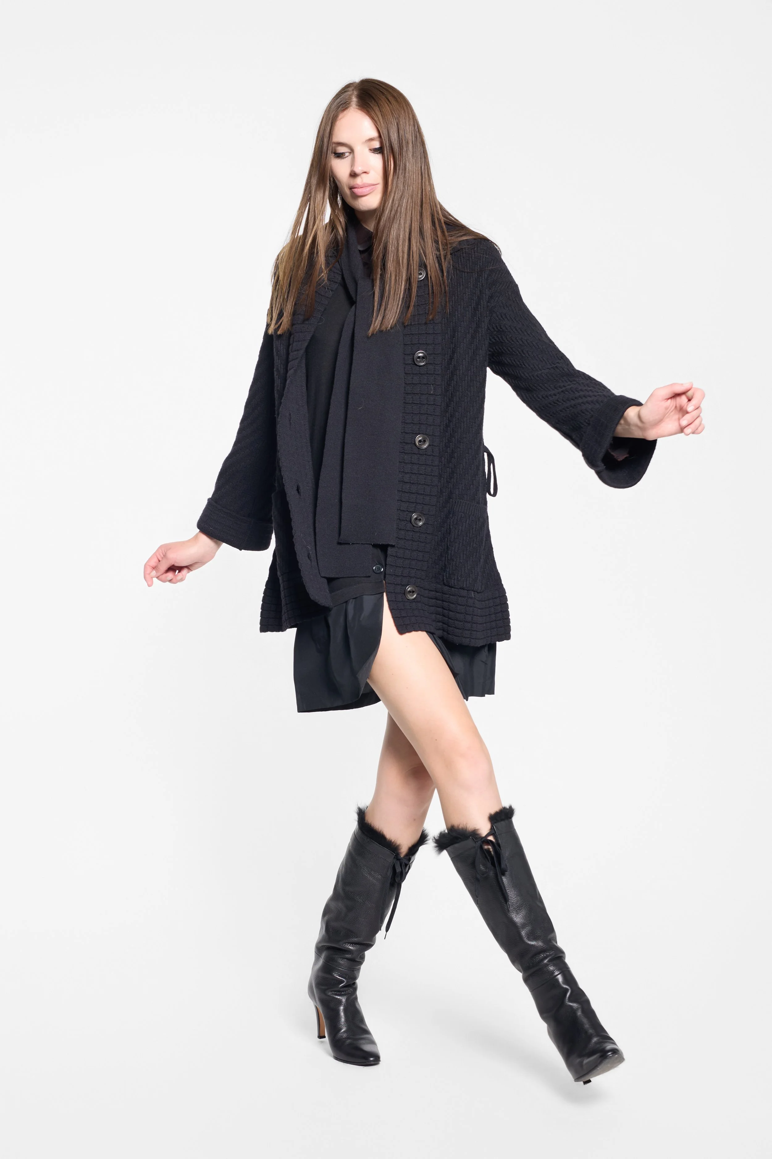 Full-length editorial view of Sonia Rykiel belted black cardigan