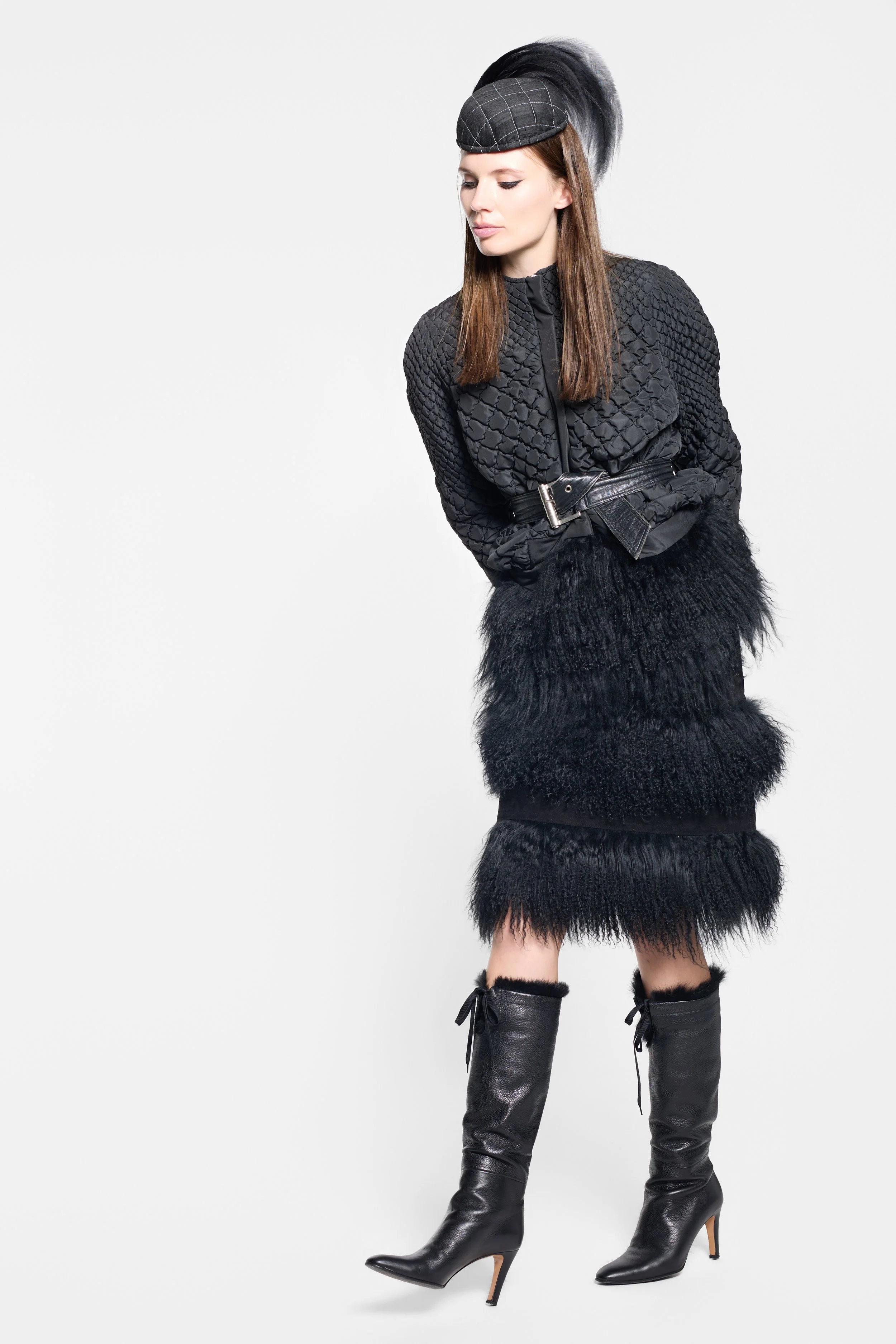 Model wearing vintage black leather skirt with Tibetan lamb fur trim