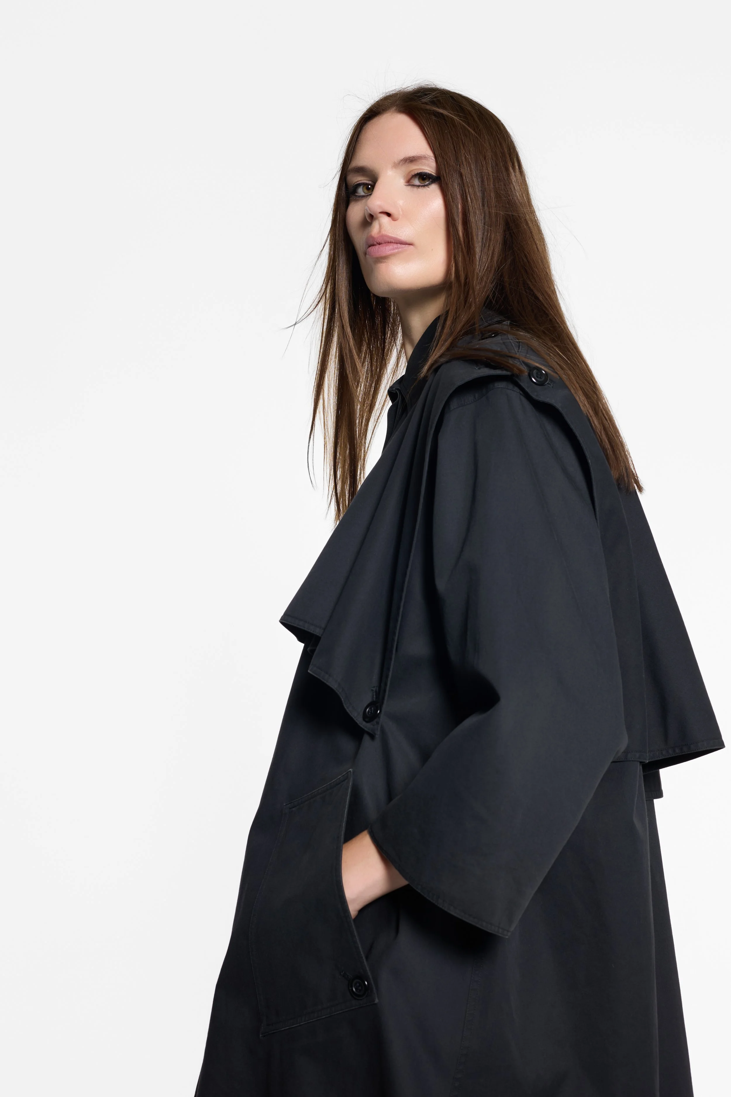 Detail of gathered back panels and buttoned construction on vintage Ungaro trench