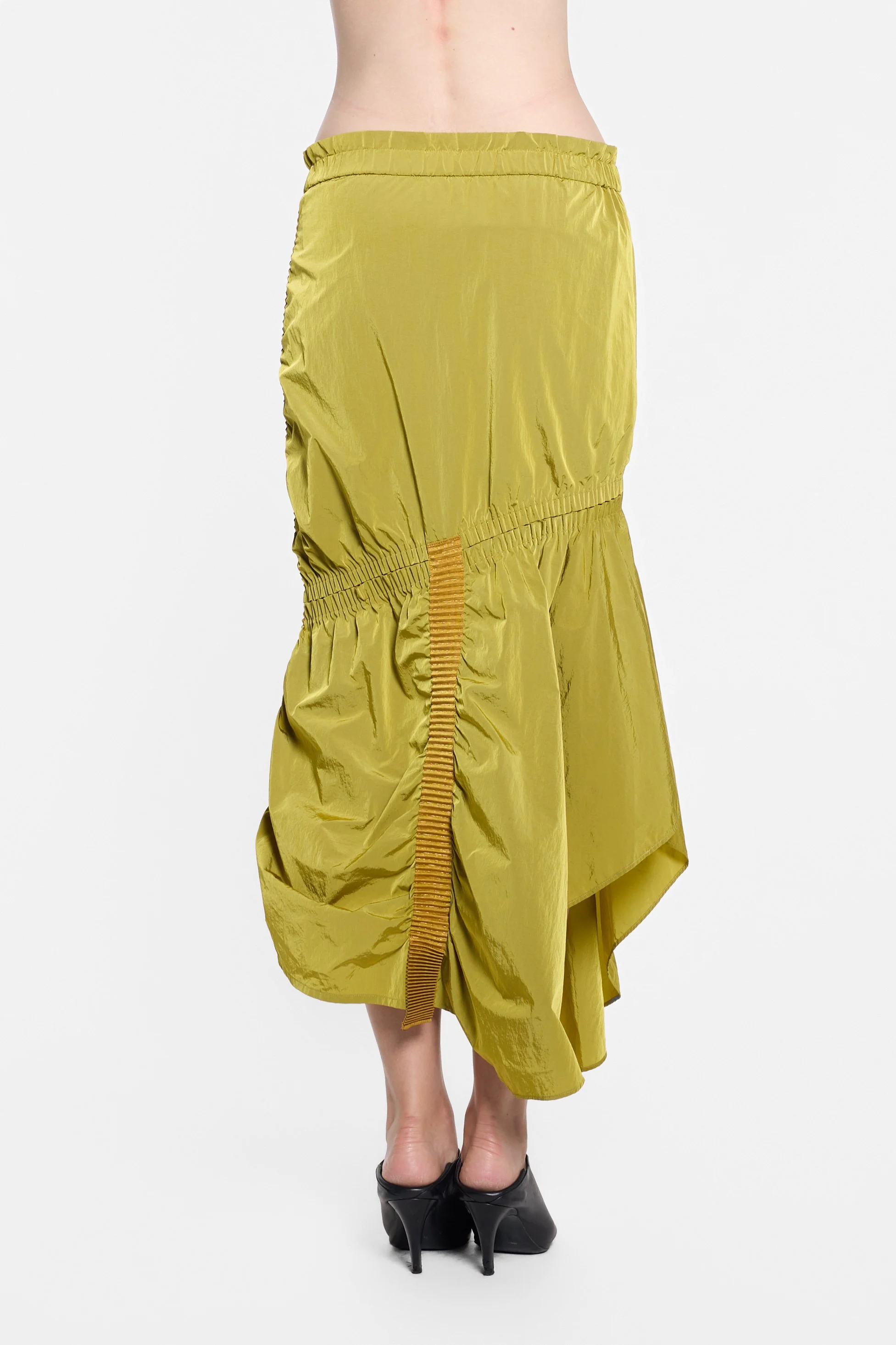 Back view of UN3D chartreuse skirt with vertical tan webbing