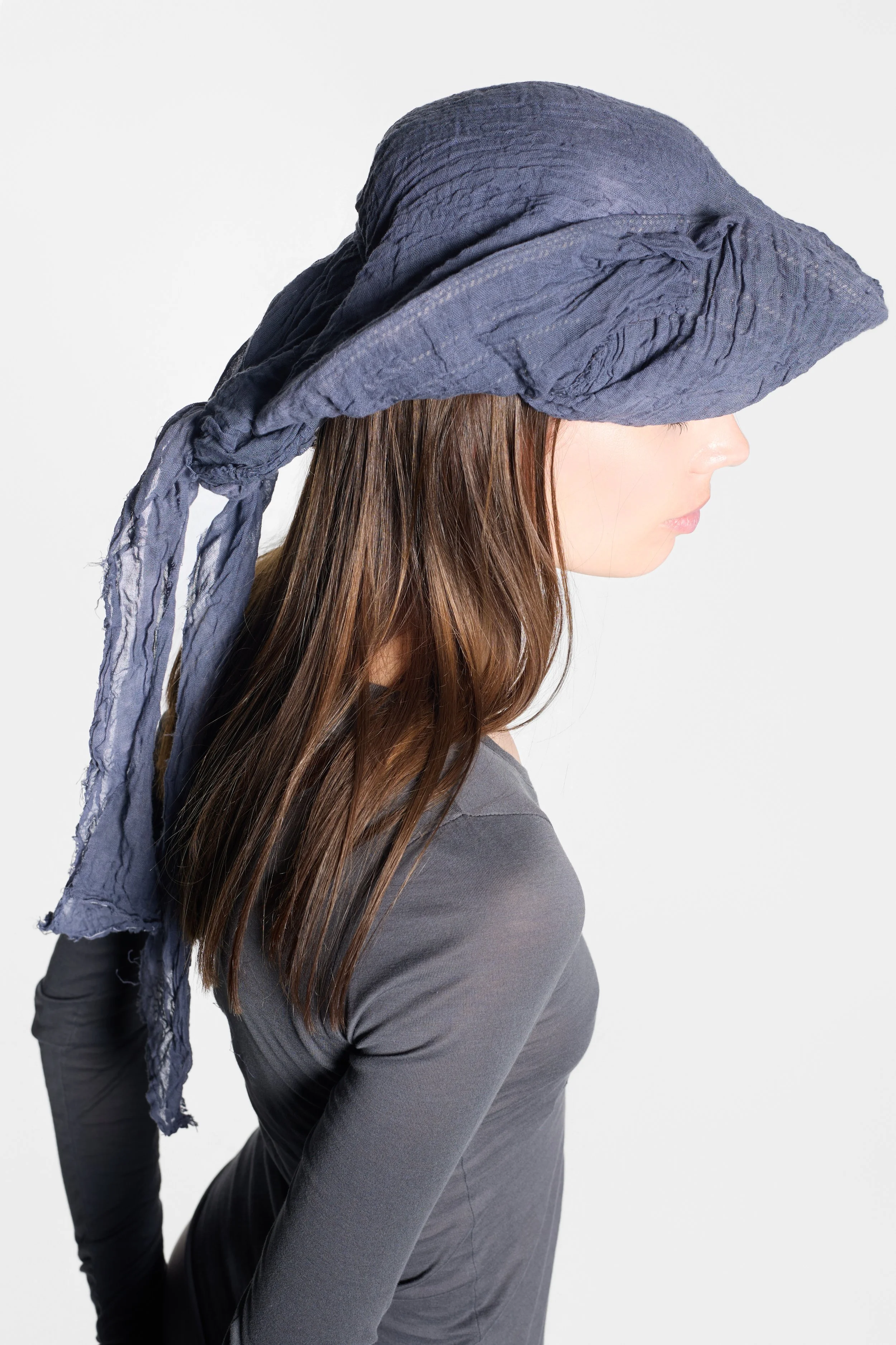 Model wearing MVUDSLYDE slate grey draped tricorn hat