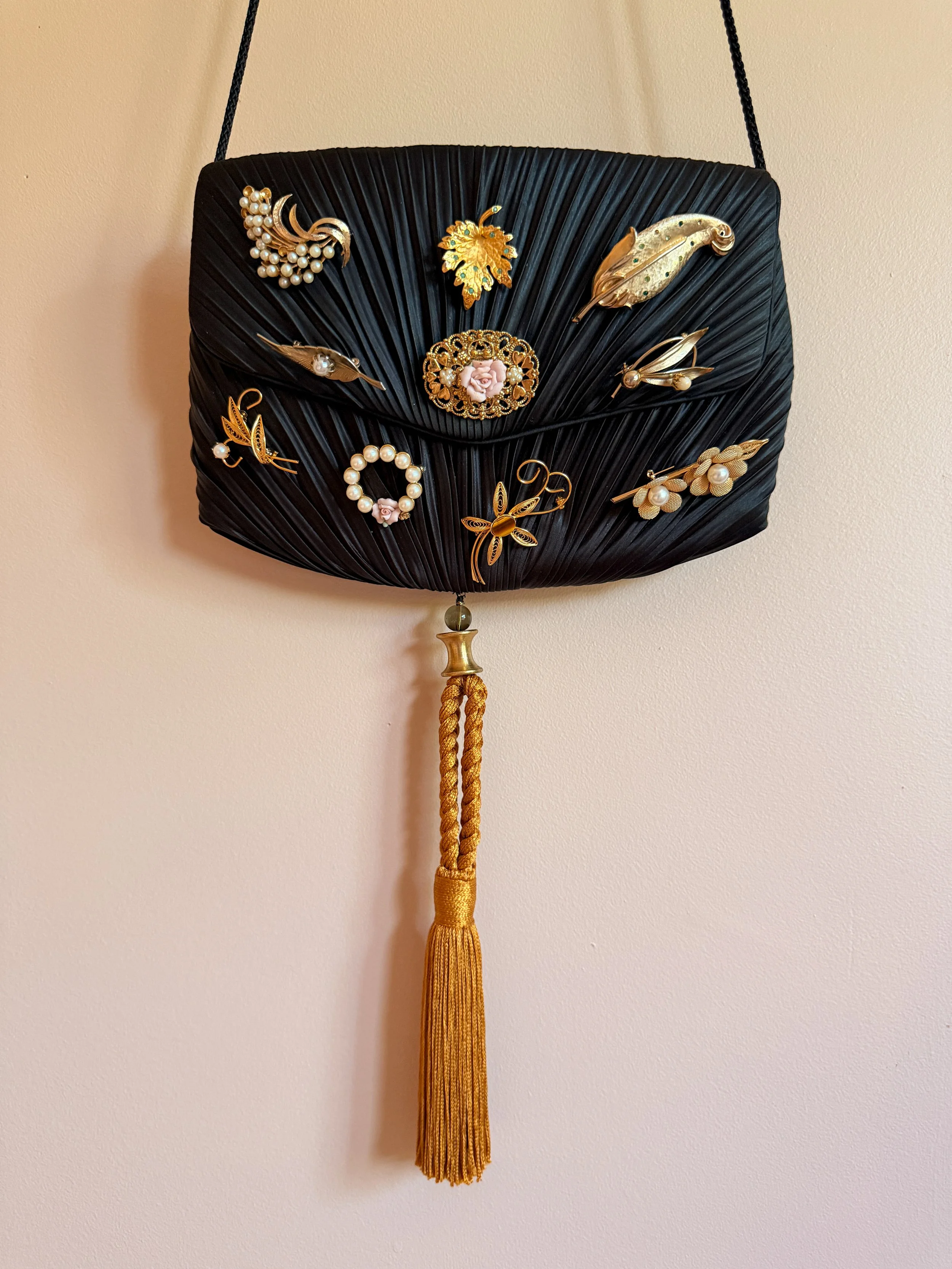 Bejeweled Pleated Handbag with Tassel