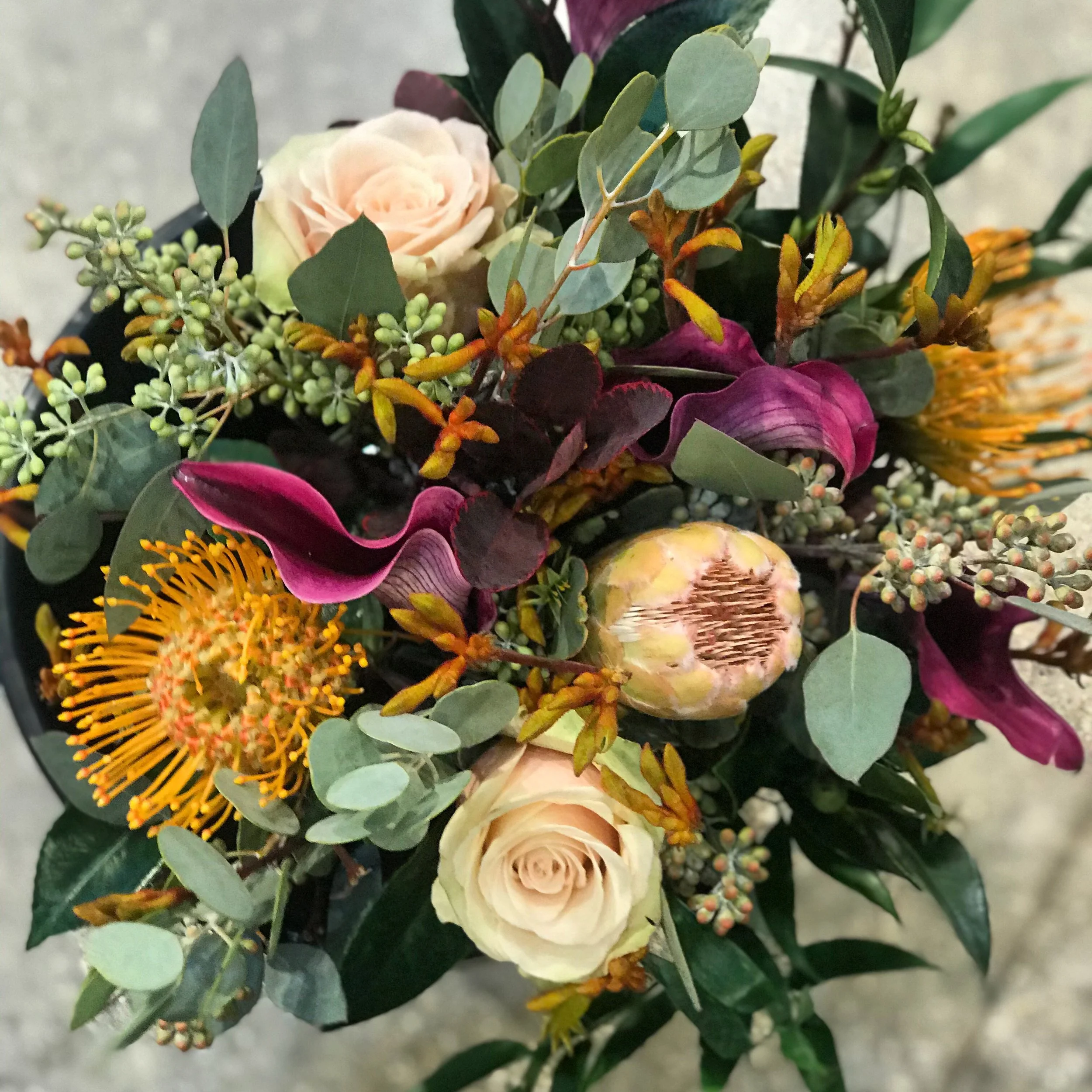 Bridal Bouquet Tropical Muted, pincushion proteas, pink protea, Sahara rose, kangaroo paw, different unique bridal bouquet design