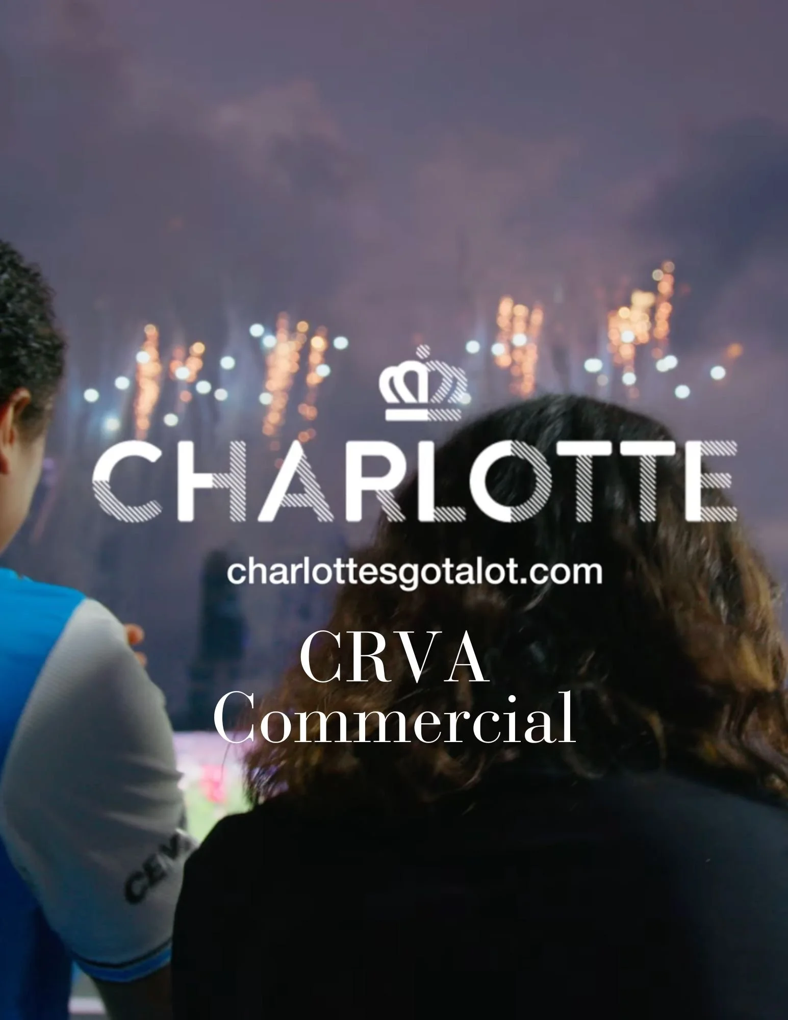 People watching fireworks in Charlotte at night.