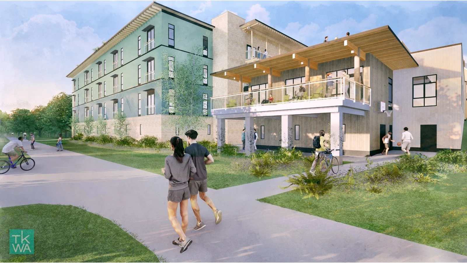A modern multi-story residential building with green and beige facades, surrounded by a landscaped lawn with pathways. People are walking, biking, and socializing outdoors, with some on a balcony and others on the ground level.