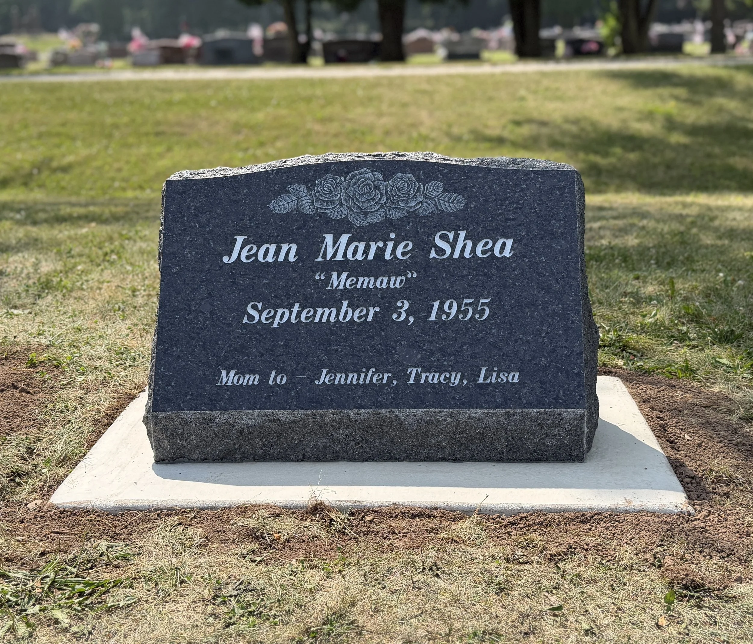 Granite single person slant marker. Timeless Tribute Memorials LLC Oshkosh, WI