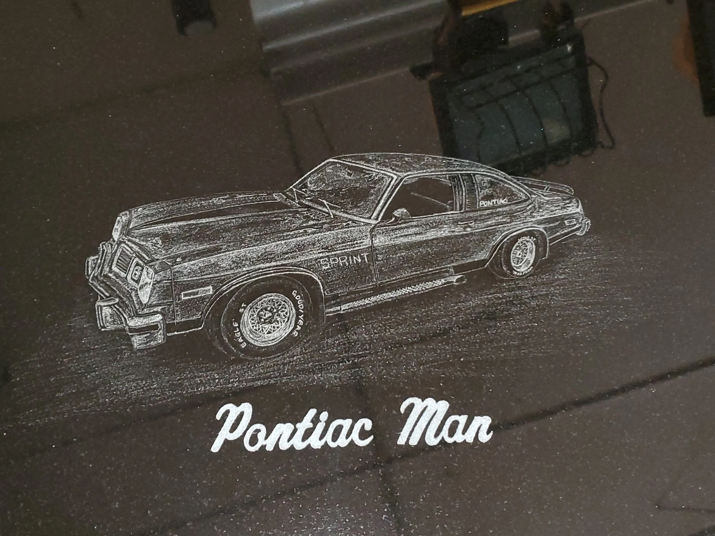 Custom car etching on monument in Oshkosh WI