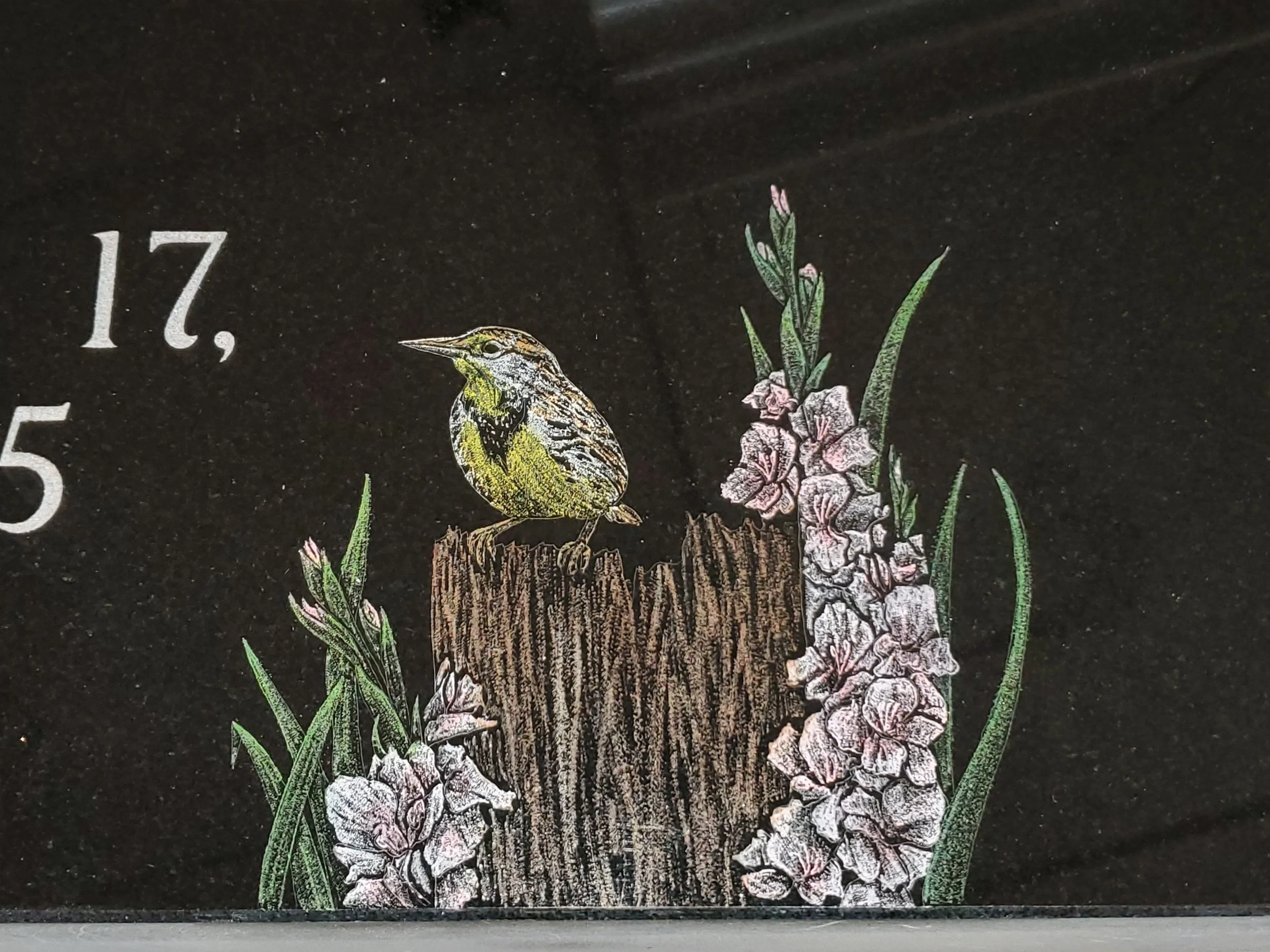 Custom monument etching of bird and flowers. Timeless Tribute Memorials LLC Oshkosh, WI