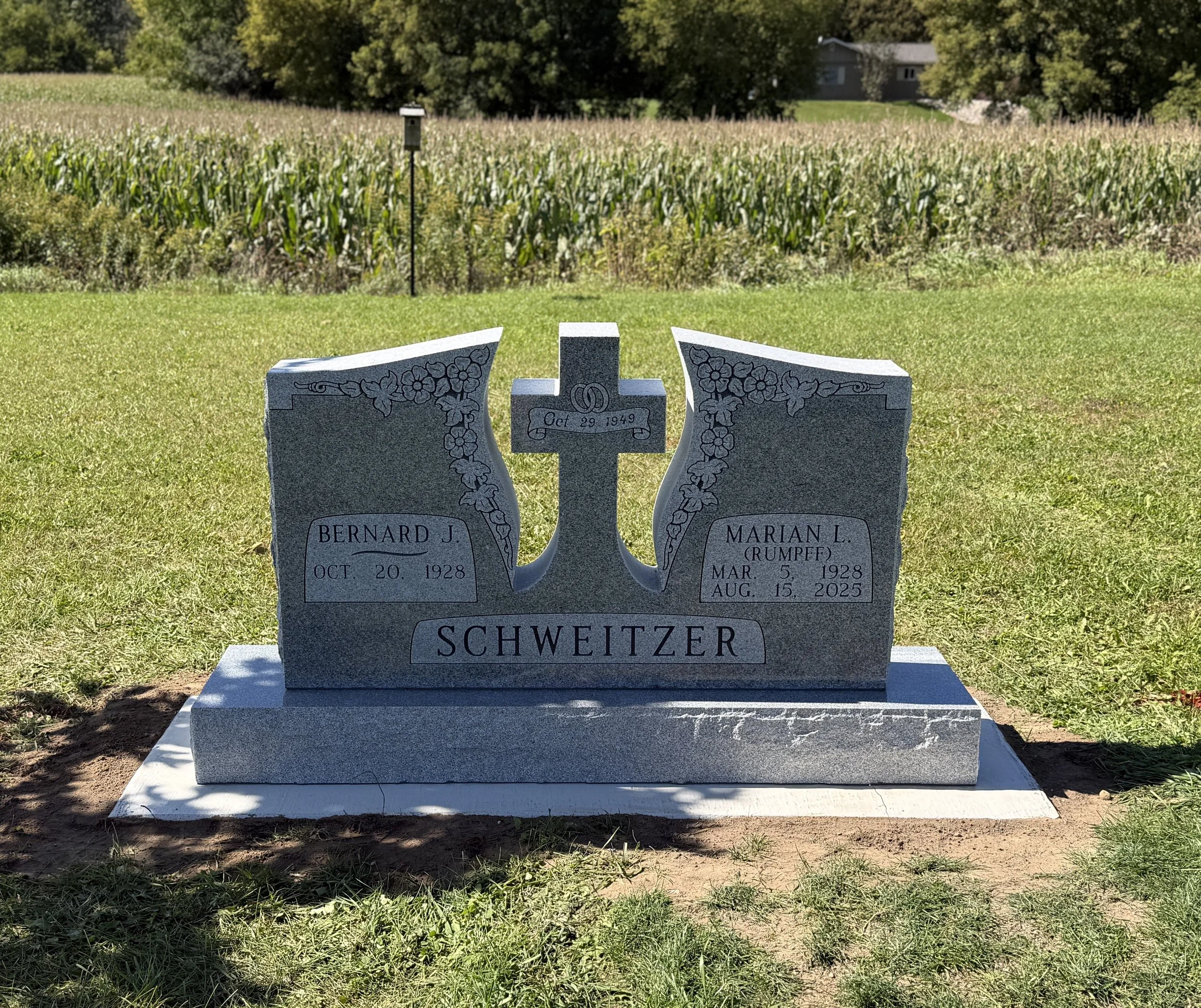 Companion Monument in Grey Granite with custom cross cutout and shape carvings. Timeless Tribute Memorials Oshkosh, WI
