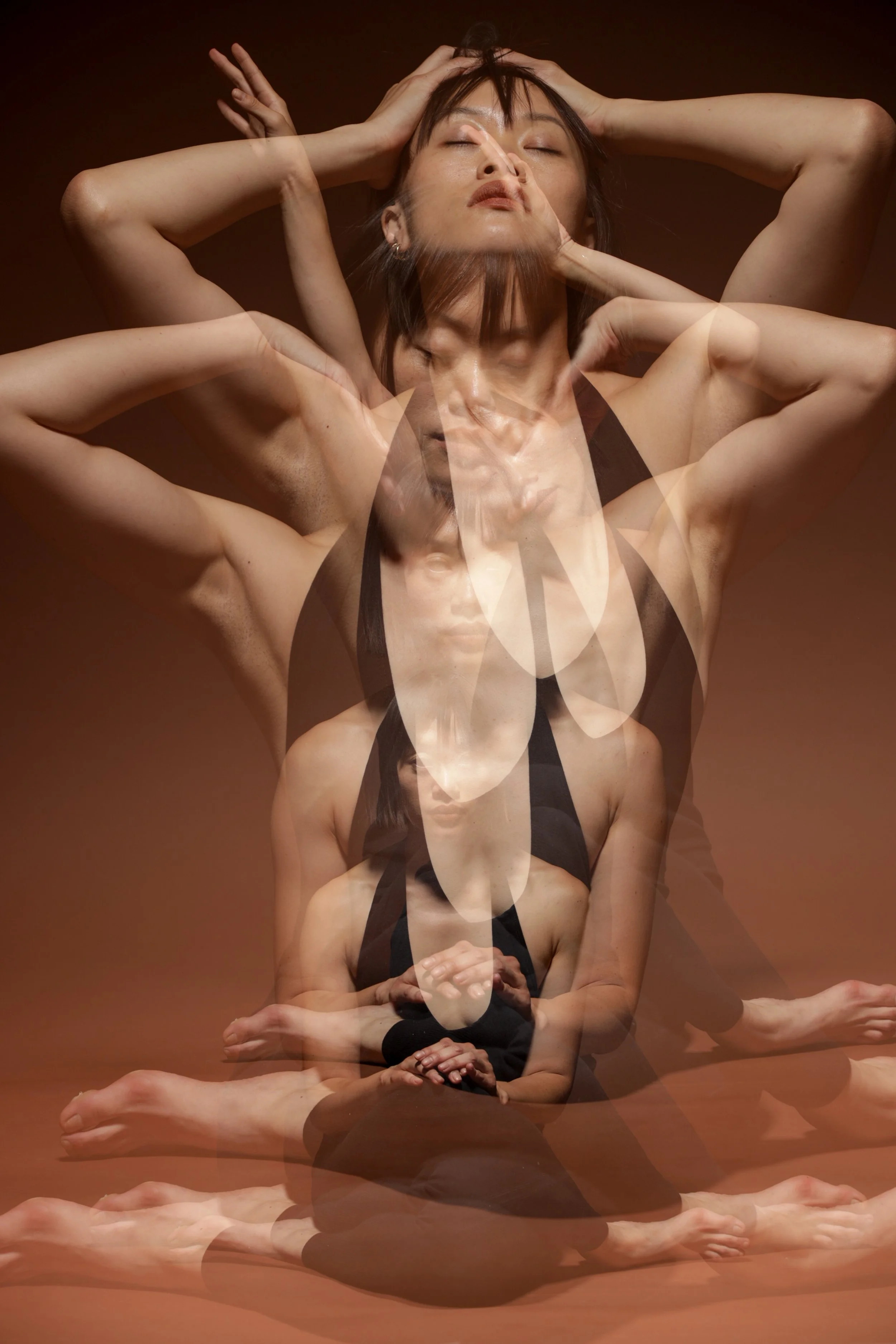 Multiple overlapping images of a woman with short hair, wearing a black top, in various poses with hands on her head and eyes closed, against a brown background, creating a layered, artistic effect.