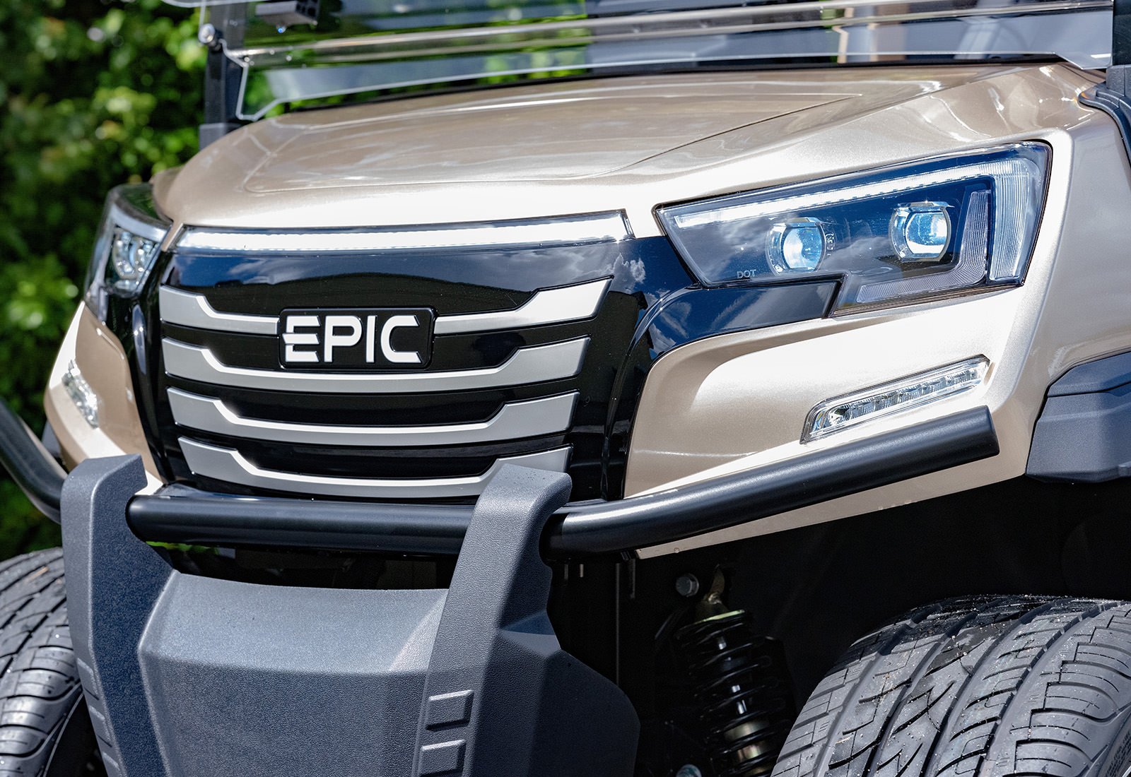 Close-up of the front section of an EPIC golf cart, featuring headlights, grille, and bumper.
