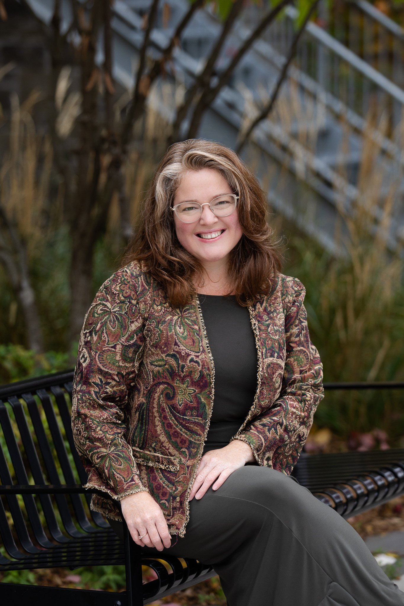 Chantal Garneau, Ward 3 Town Councillor for Halton Hills, seated outdoors and smiling.