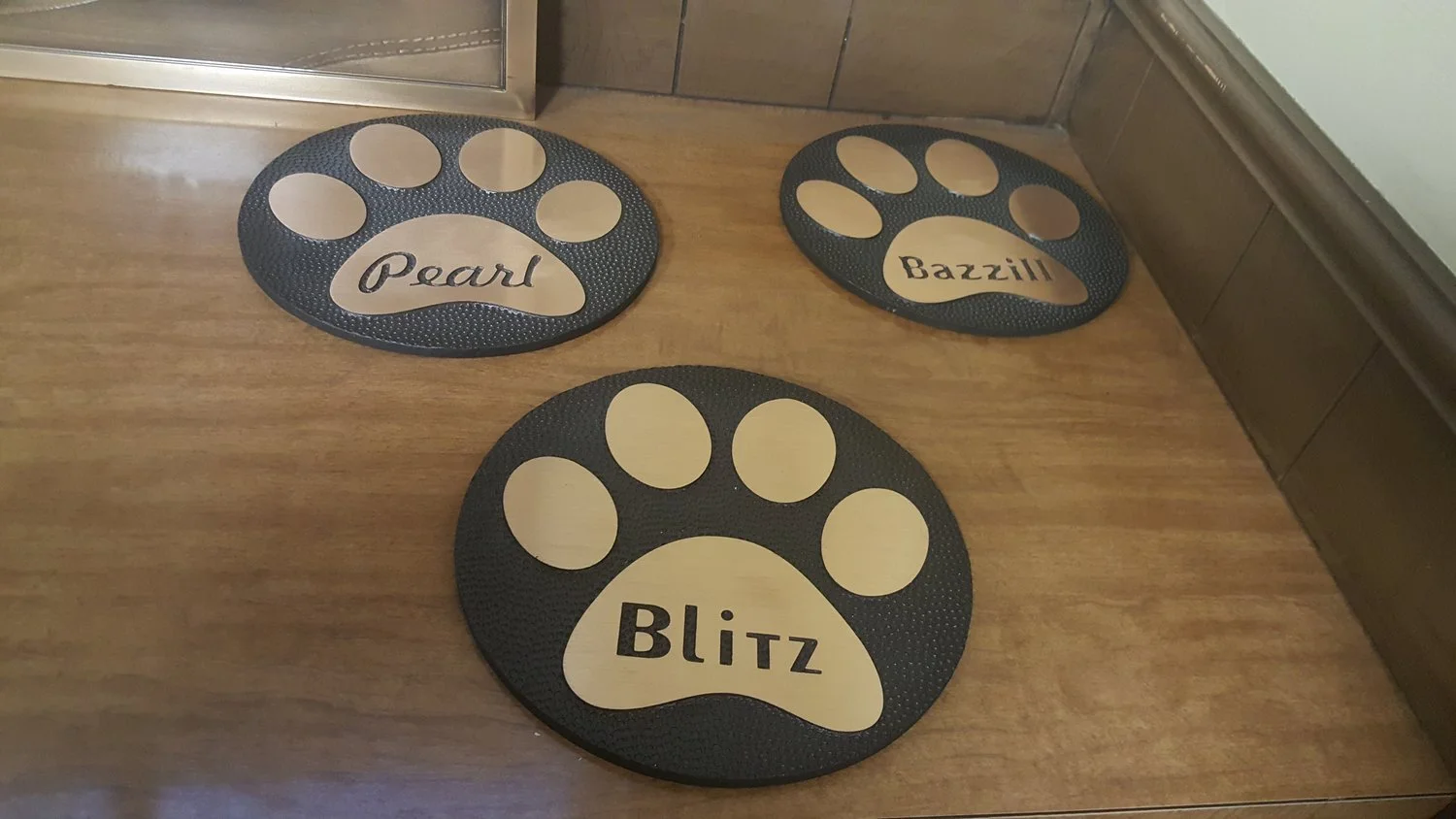 Architectural signage pet memorial plaques with custom names and paw designs, crafted by a compassionate signage supplier.