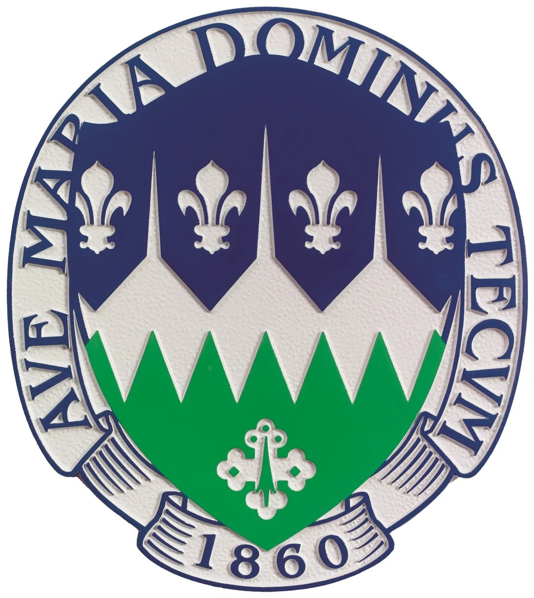 Institutional crest designed as a custom 3d bas relief plaque showing sculpted heraldic symbols commonly featured in decorative bas relief plaques.