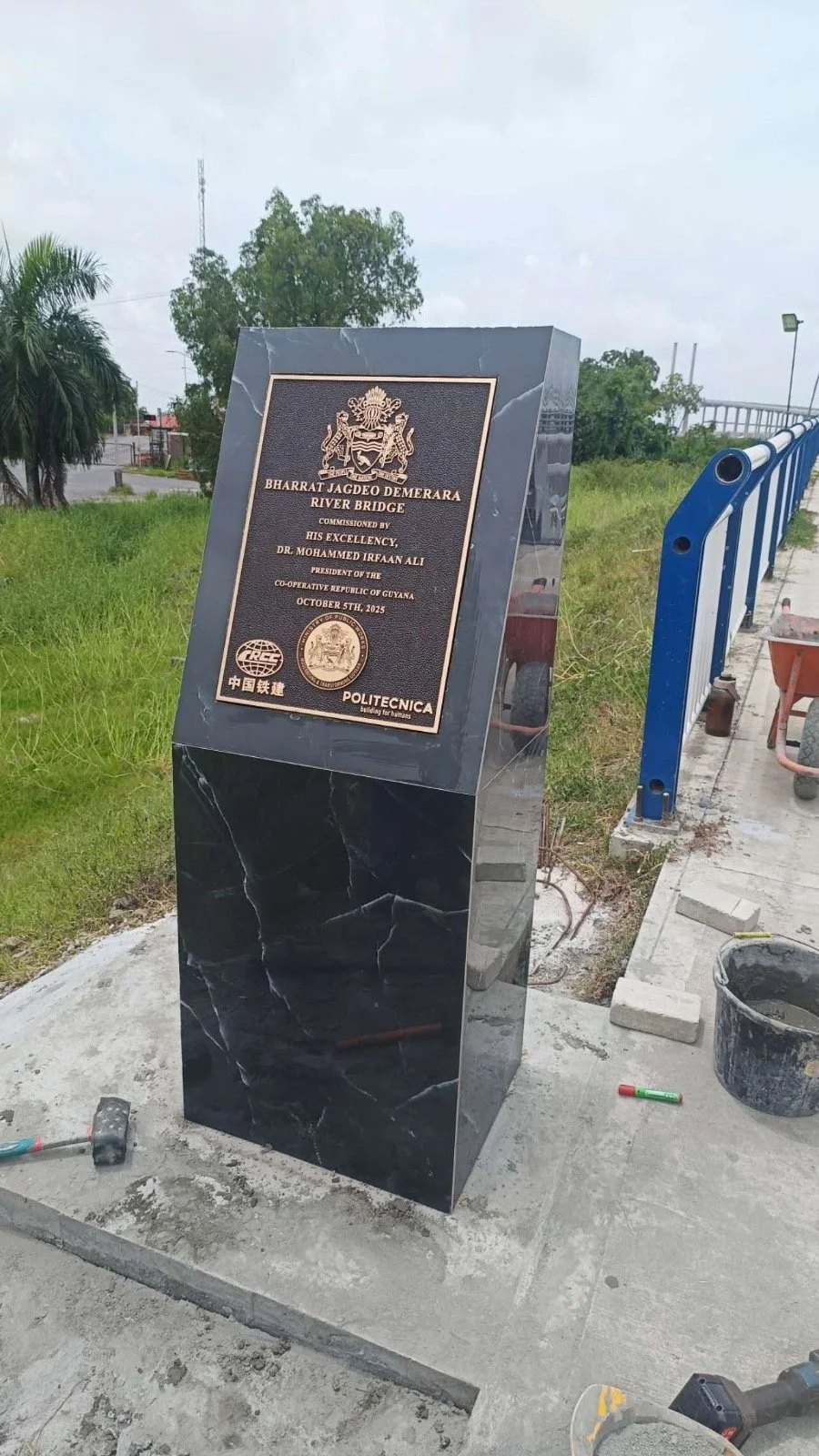 Custom bronze government plaque mounted on a monument for the Bharrat Jagdeo Demerara River Bridge, demonstrating durable metal craftsmanship for government dedications, public infrastructure, and commemorative projects.