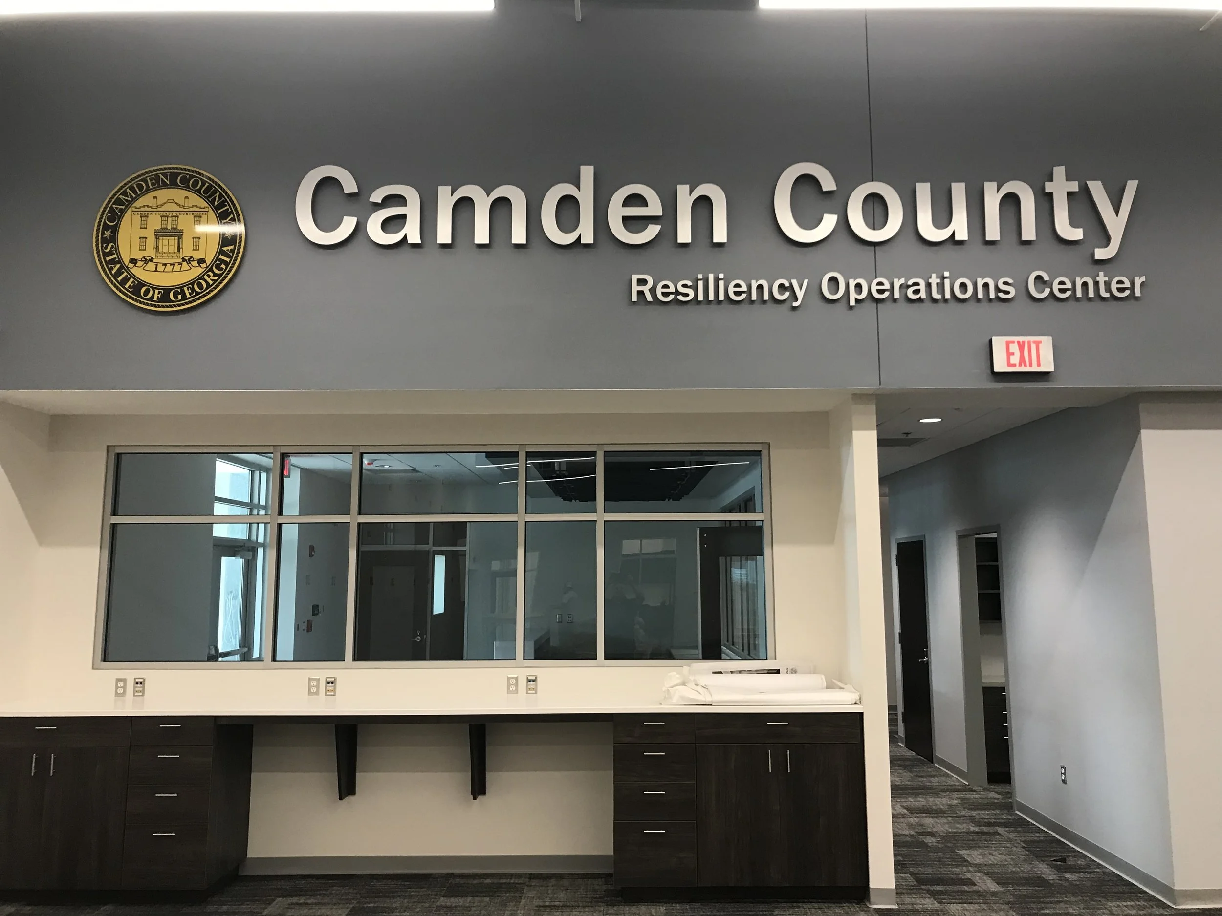 Camden County Resiliency Operations Center interior installation featuring government plaque and municipal signage for public building identification.