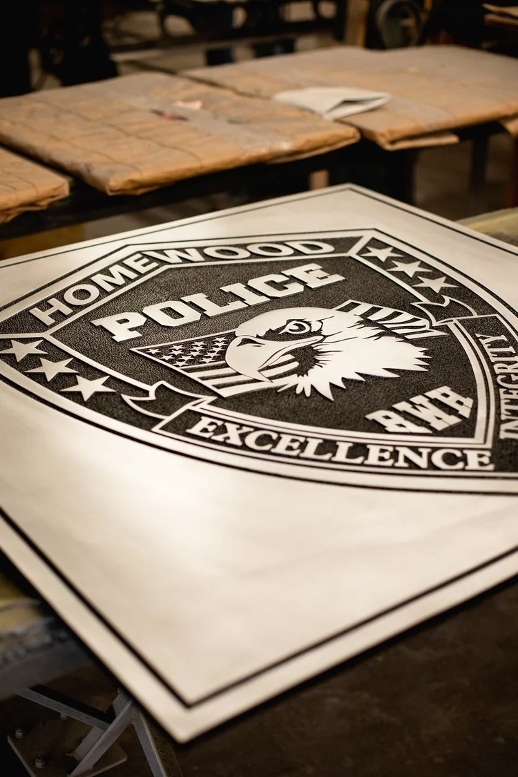 Architectural signage police department plaque showcasing custom metal detailing, produced by a trusted signage supplier for civic recognition.