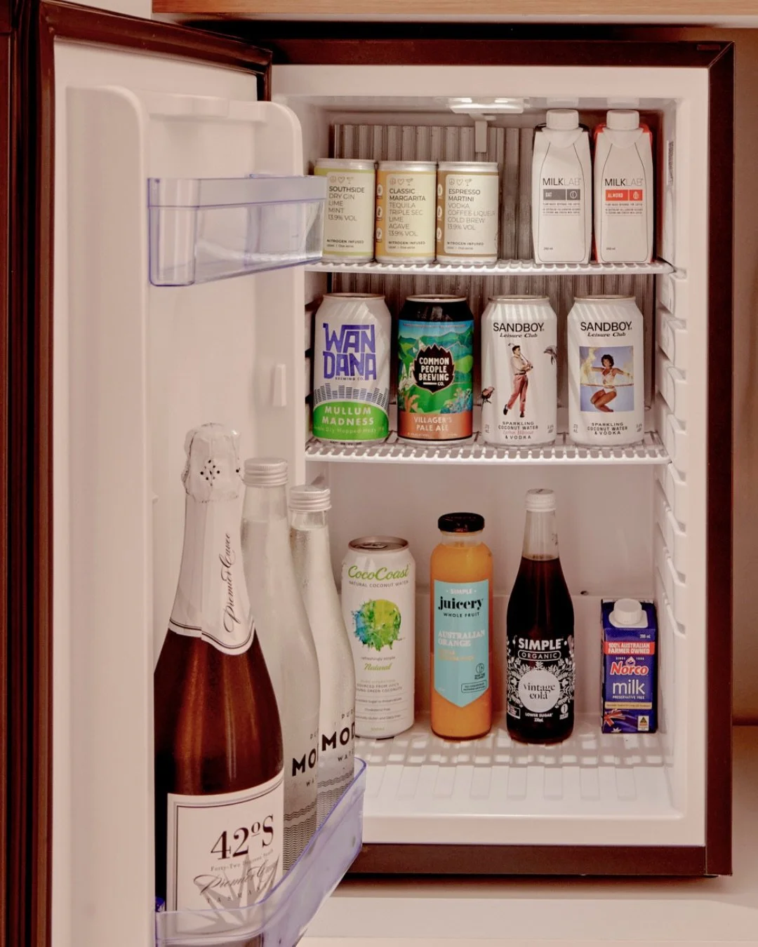 We&rsquo;ve curated our mini bar with a few of our local favourites. 

From chilled beverages to quality snacks, everything is here so you can settle in and enjoy the ease of a sanctuary that feels entirely yours.