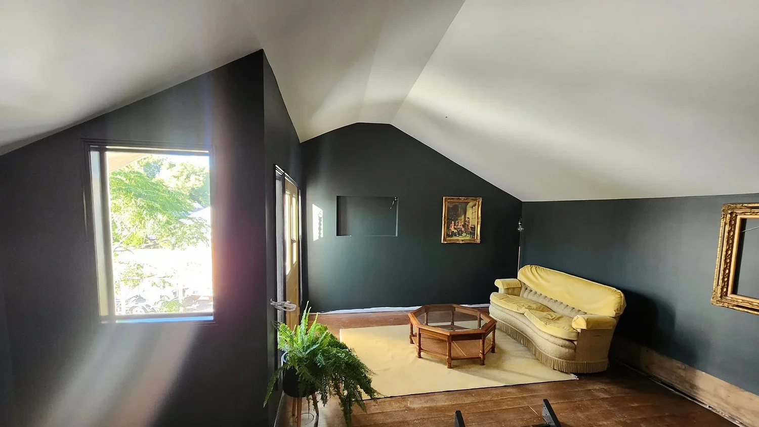 Attic room conversion with skylight and dark green walls by Massey Constructions, Bendigo