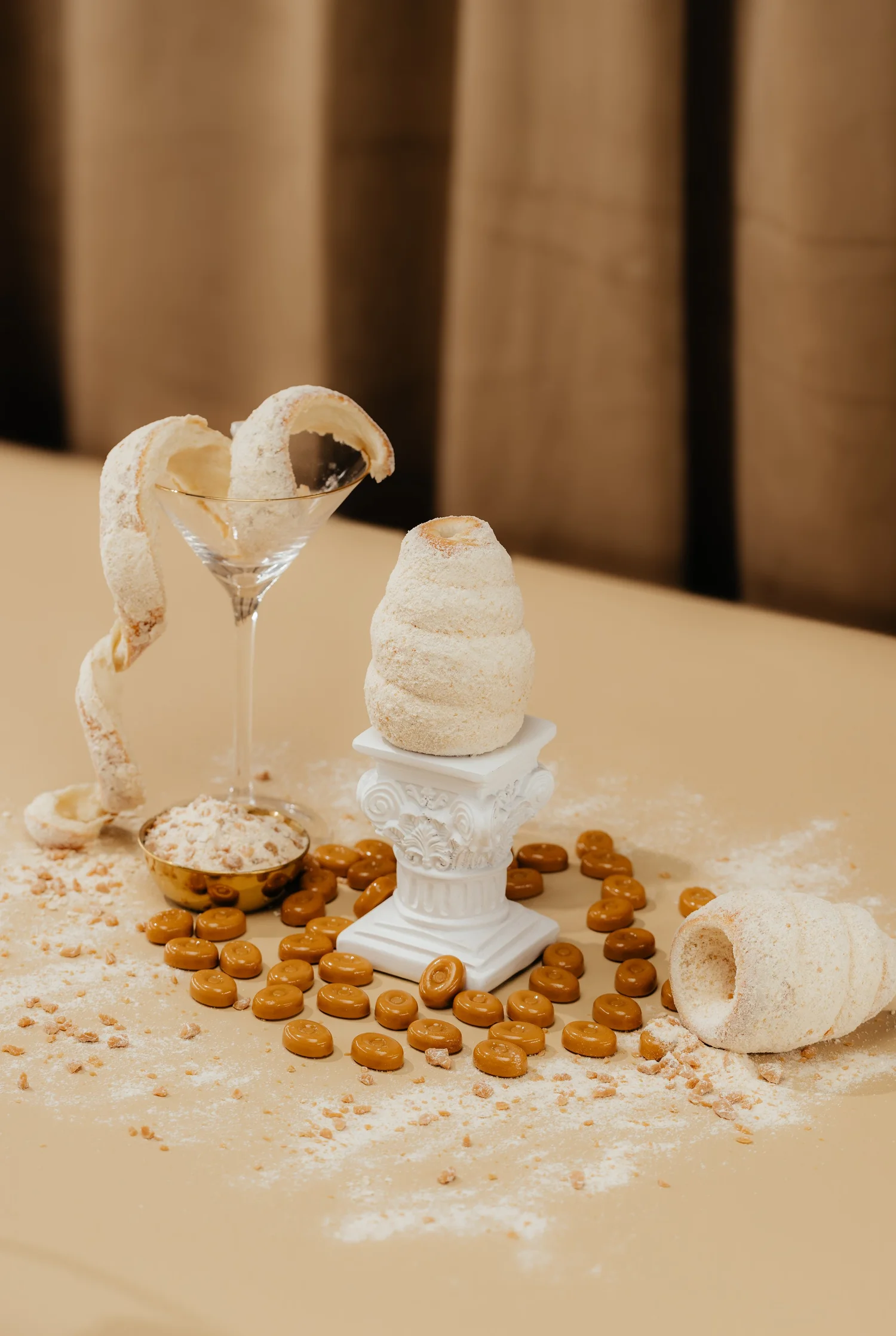 Crispy Cones pastry cones styled with cookies and a cocktail glass