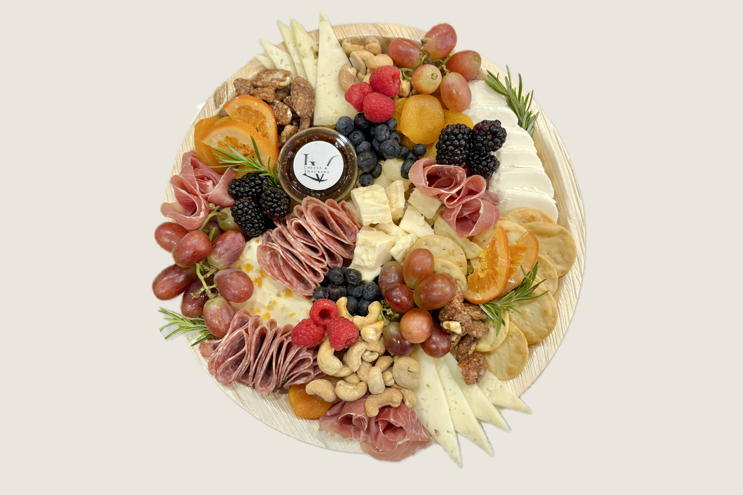 small charcuterie board with fresh fruit, crackers, and cured meats – Las Vegas event snack