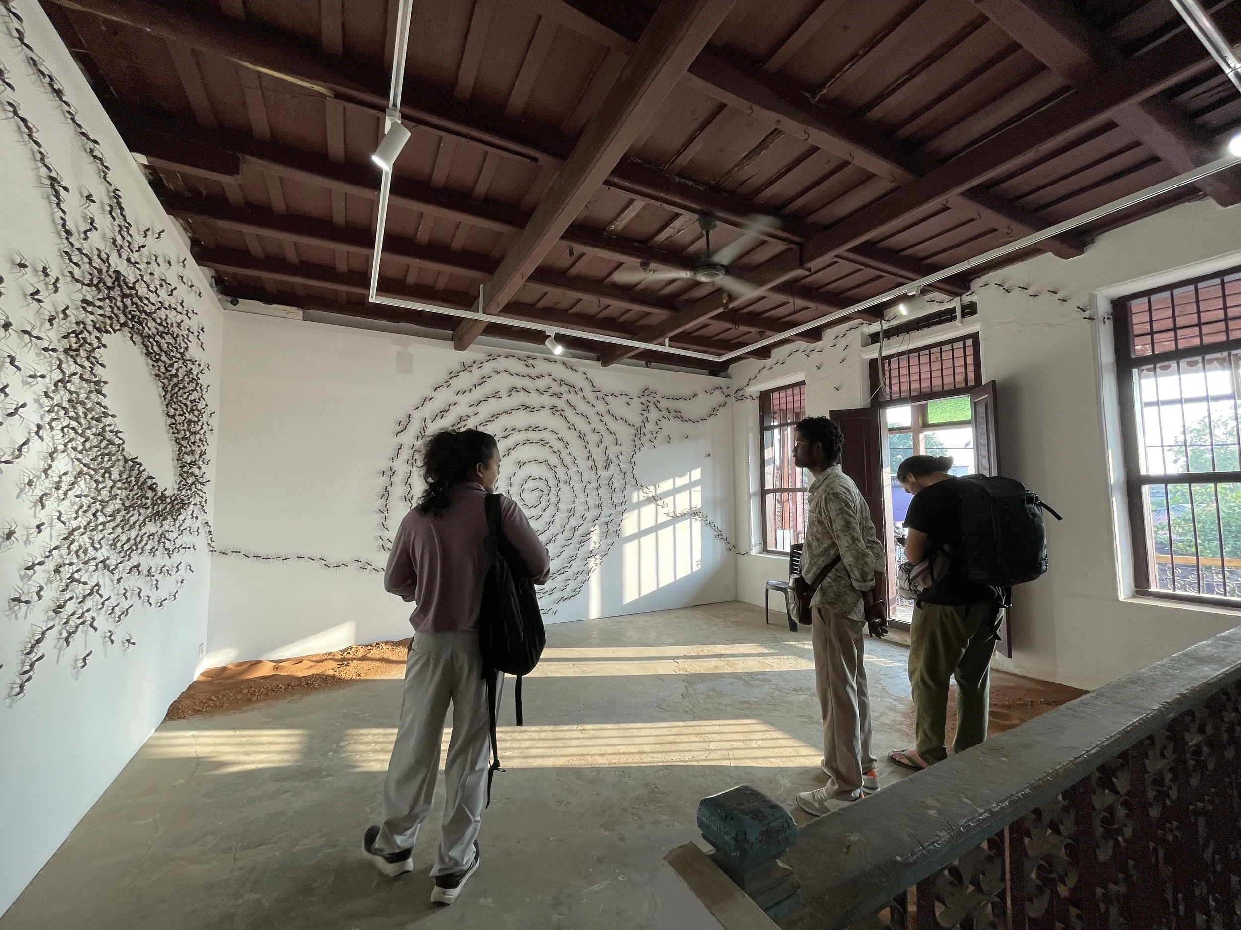 Shooting videos at BMS Warehouse, Matthancerry, in front artwork by Krishna Murty P.S. Photo by Rugun Sirait