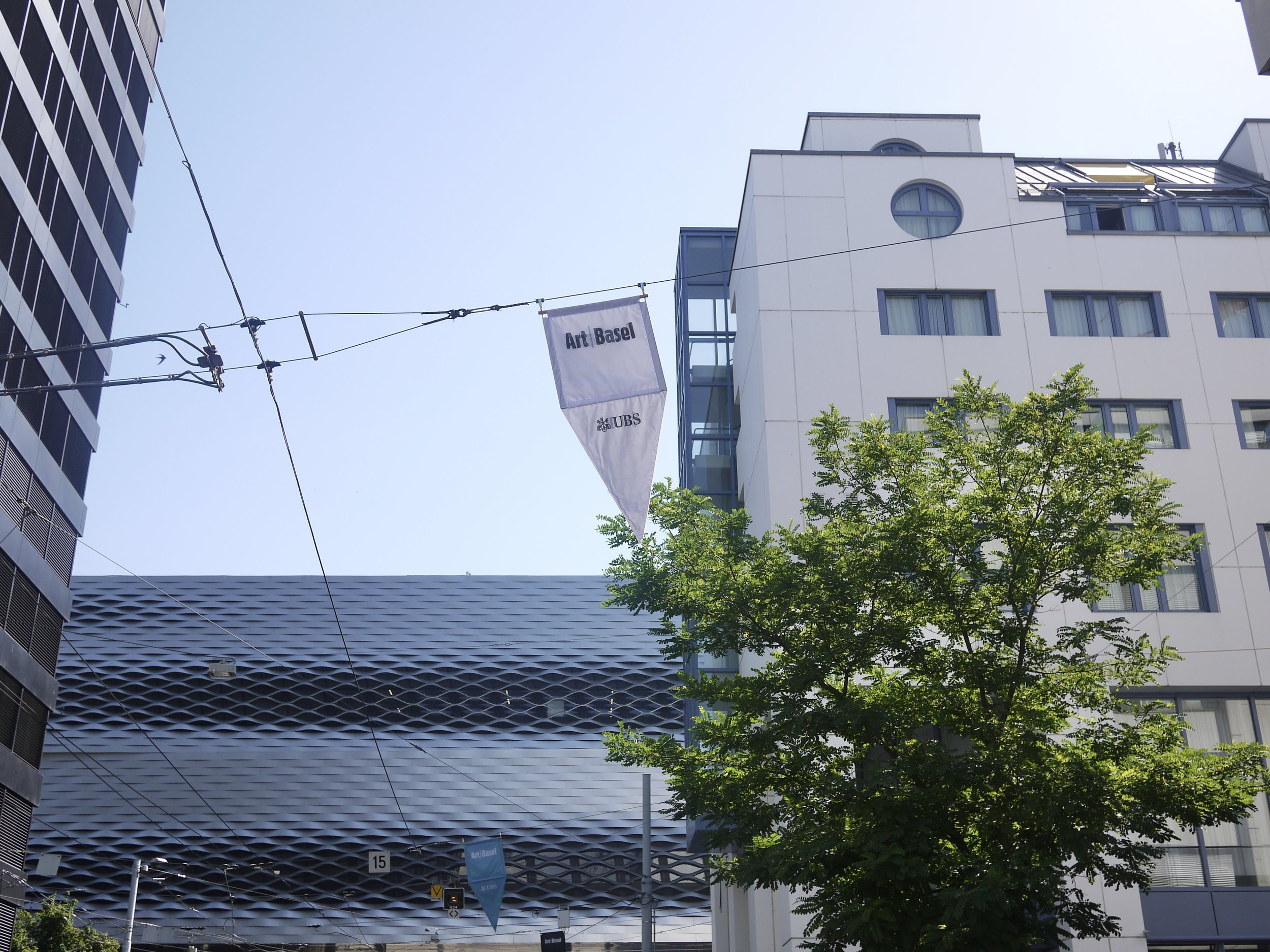 Flag banners throughout the city featuring the logos of Art Basel and its Global Lead Partner, UBS 