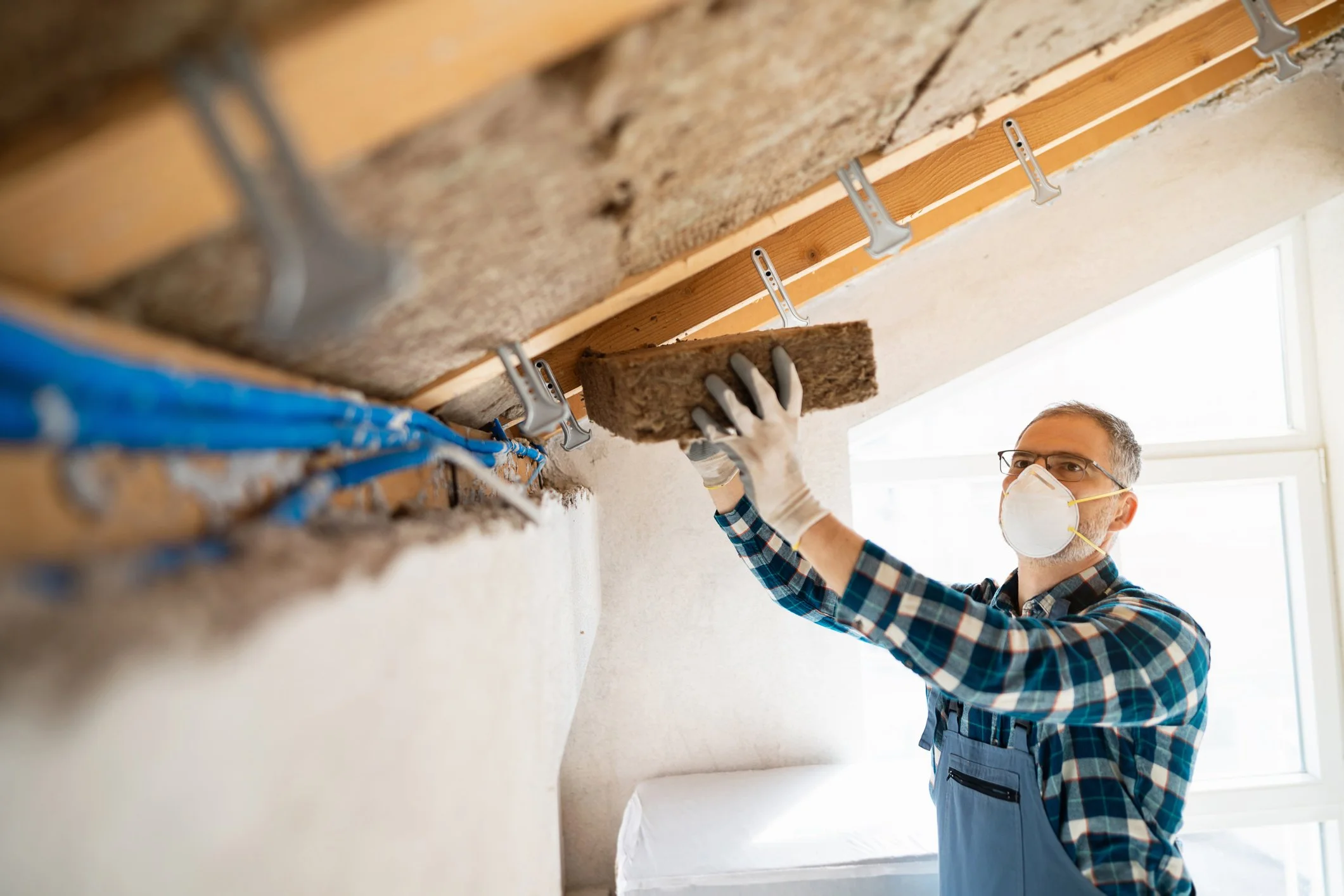 Do I need permission to install insulation in my townhouse ceiling? 