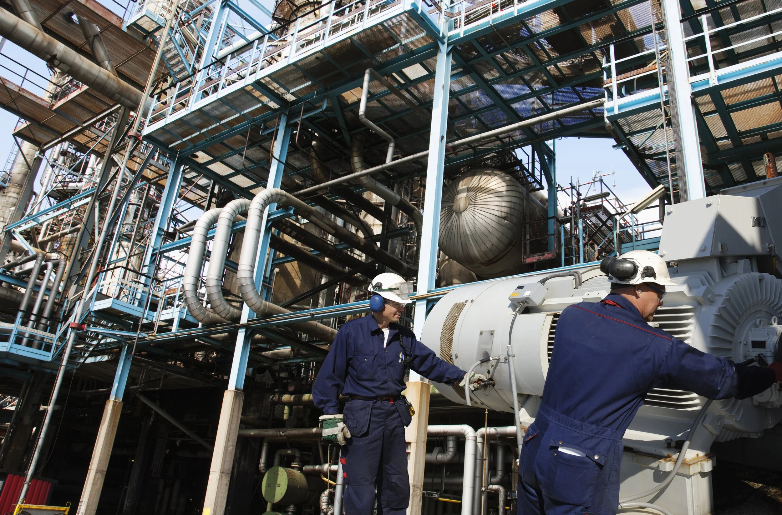 oil-engineers-inside-oil-refinery-SBI-300976942.jpg