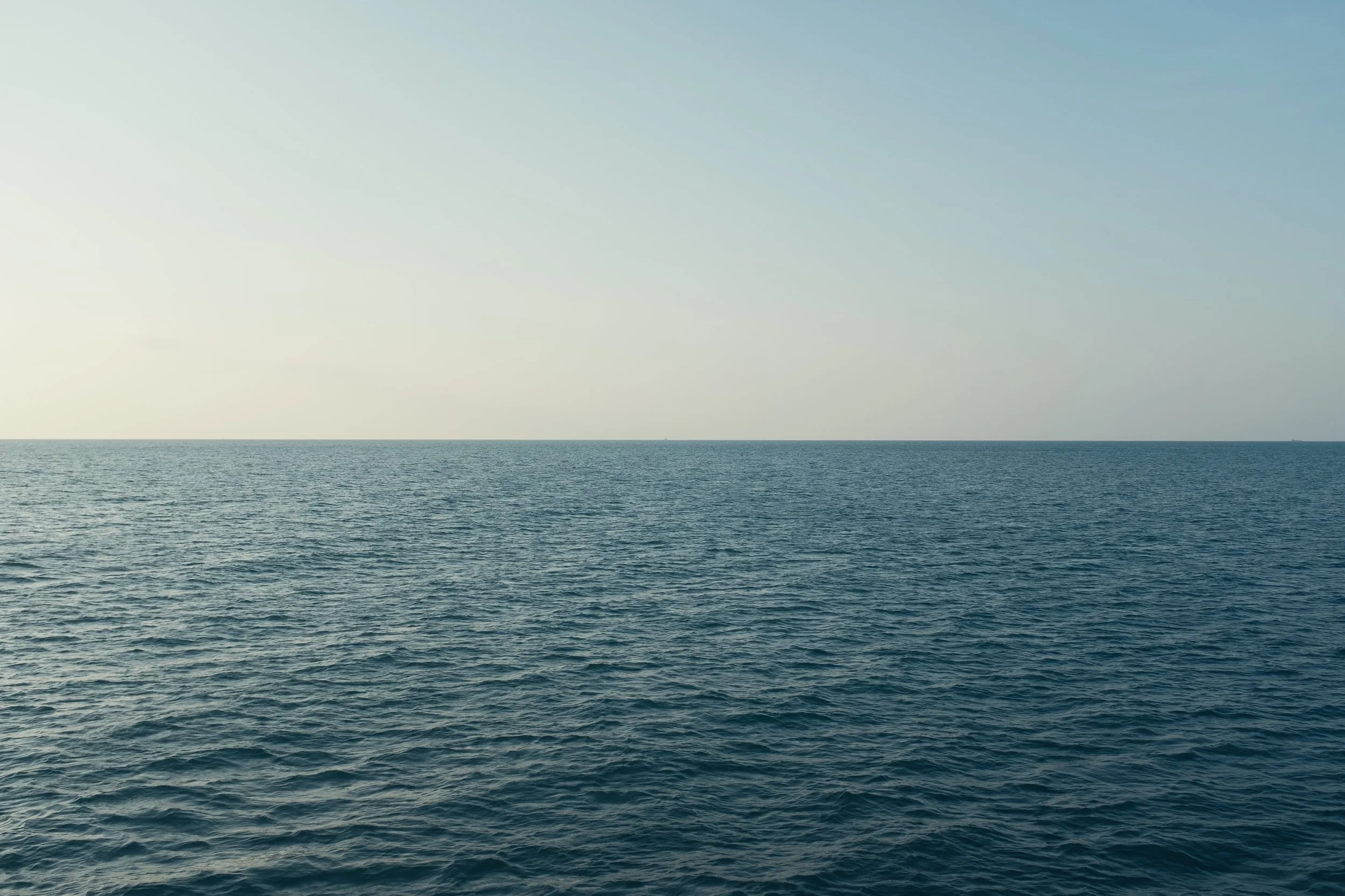 Open ocean with calm water and a clear sky