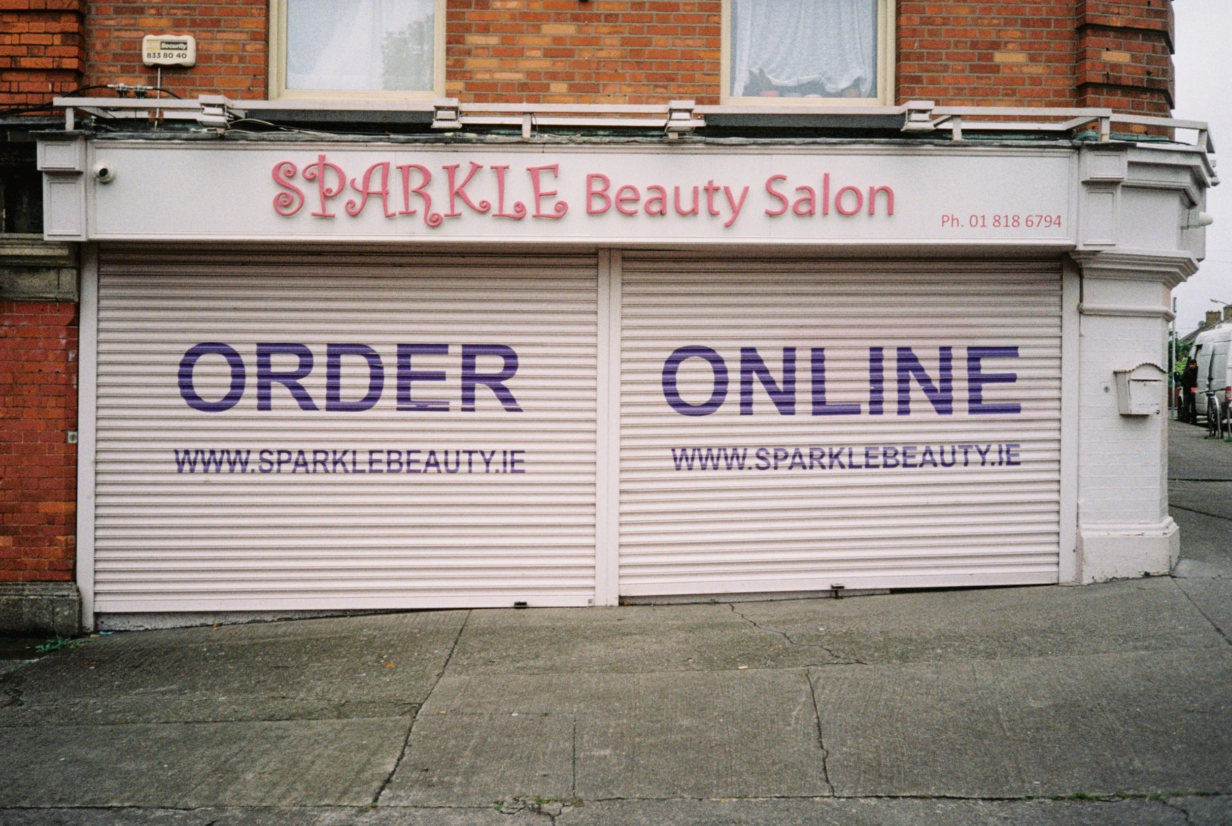 Closed storefront of Sparkle Beauty Salon with signage indicating online ordering at www.sparklebeauty.ie