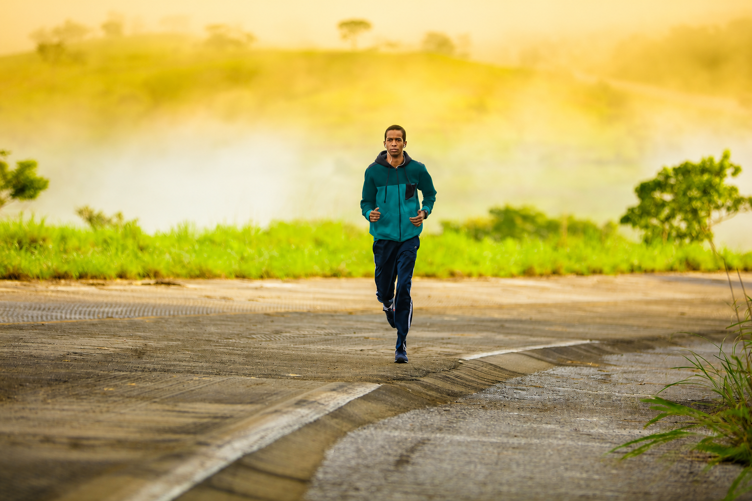 Person jogging along a misty country road, illustrating the active lifestyle approach to health - Metabolic Health Pro.