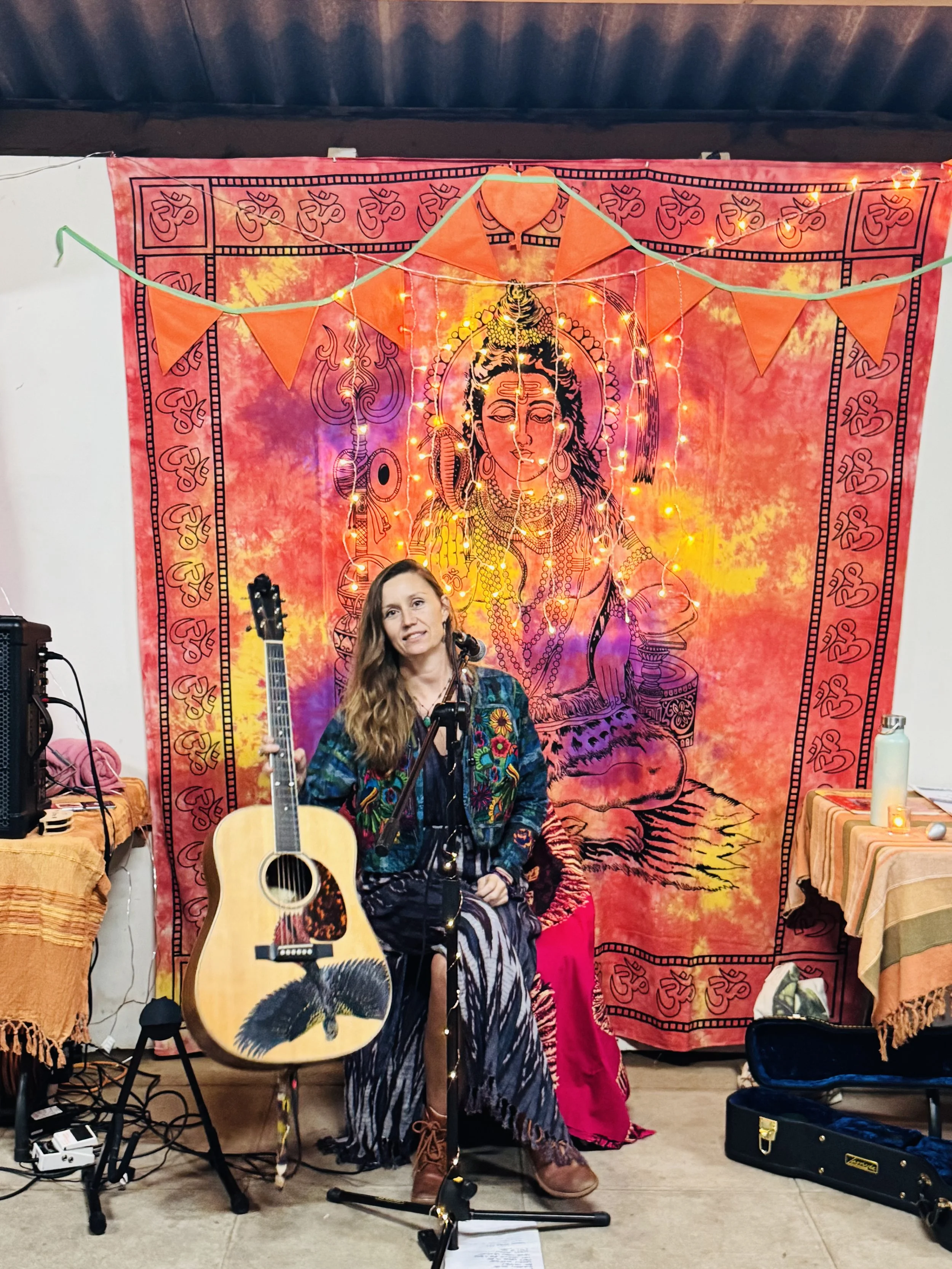 Woman with guitar and microphone