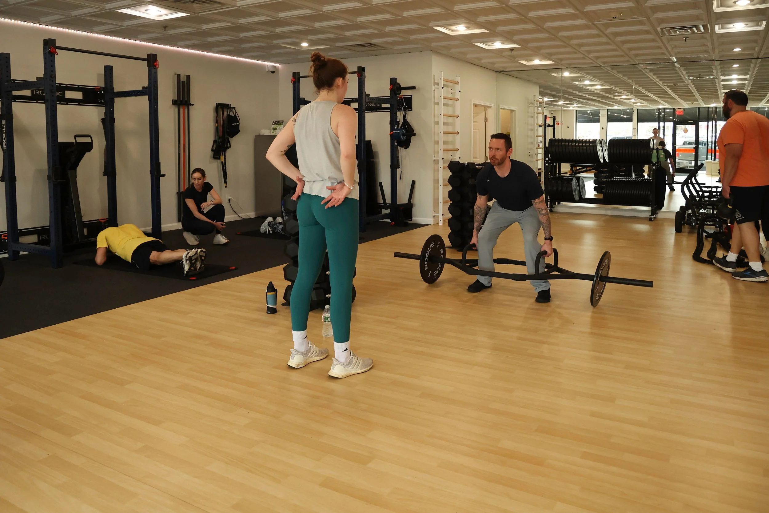 Founder- Christopher Ryan demonstrating a trap-bar deadlift which is significantly safer than a back squat for individual with pack issues.