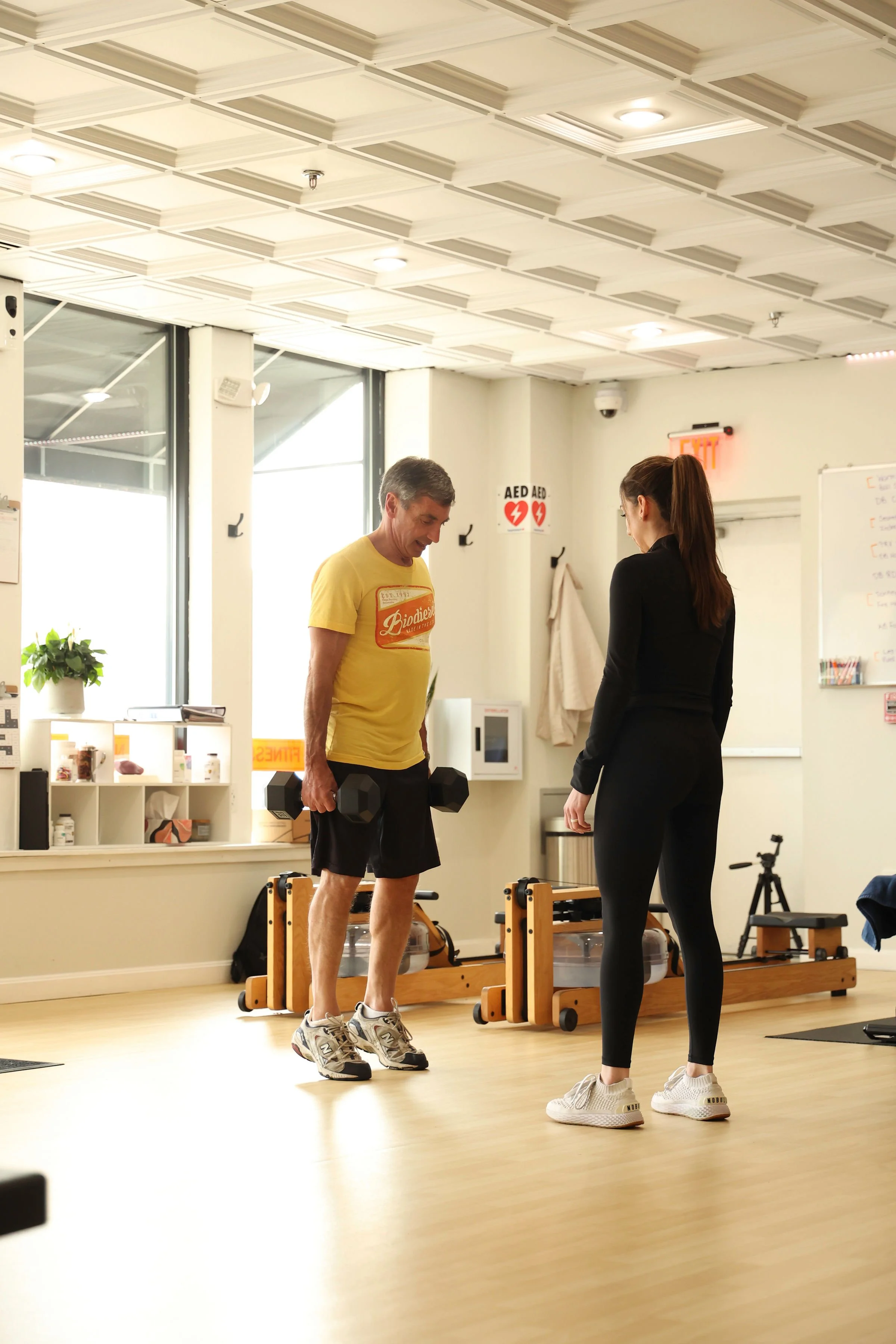 senior performing standing calf raises to improve balance under supervised coaching at The Genesis Fit in Marshfield