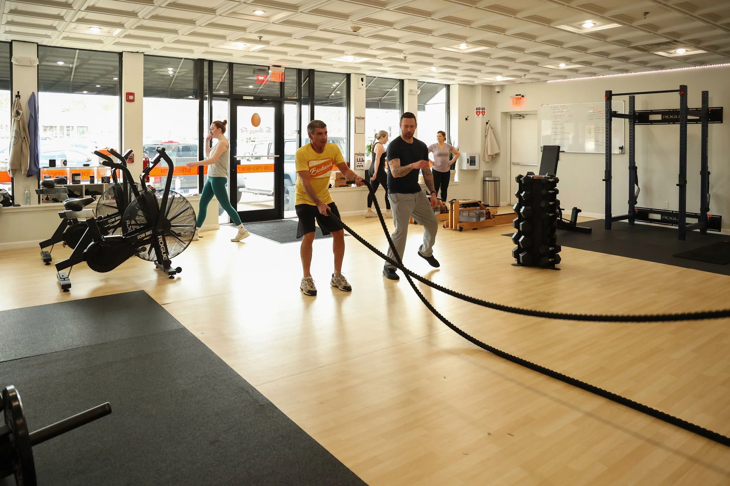 Men and women workout out in a semi-private session in marshfield ma