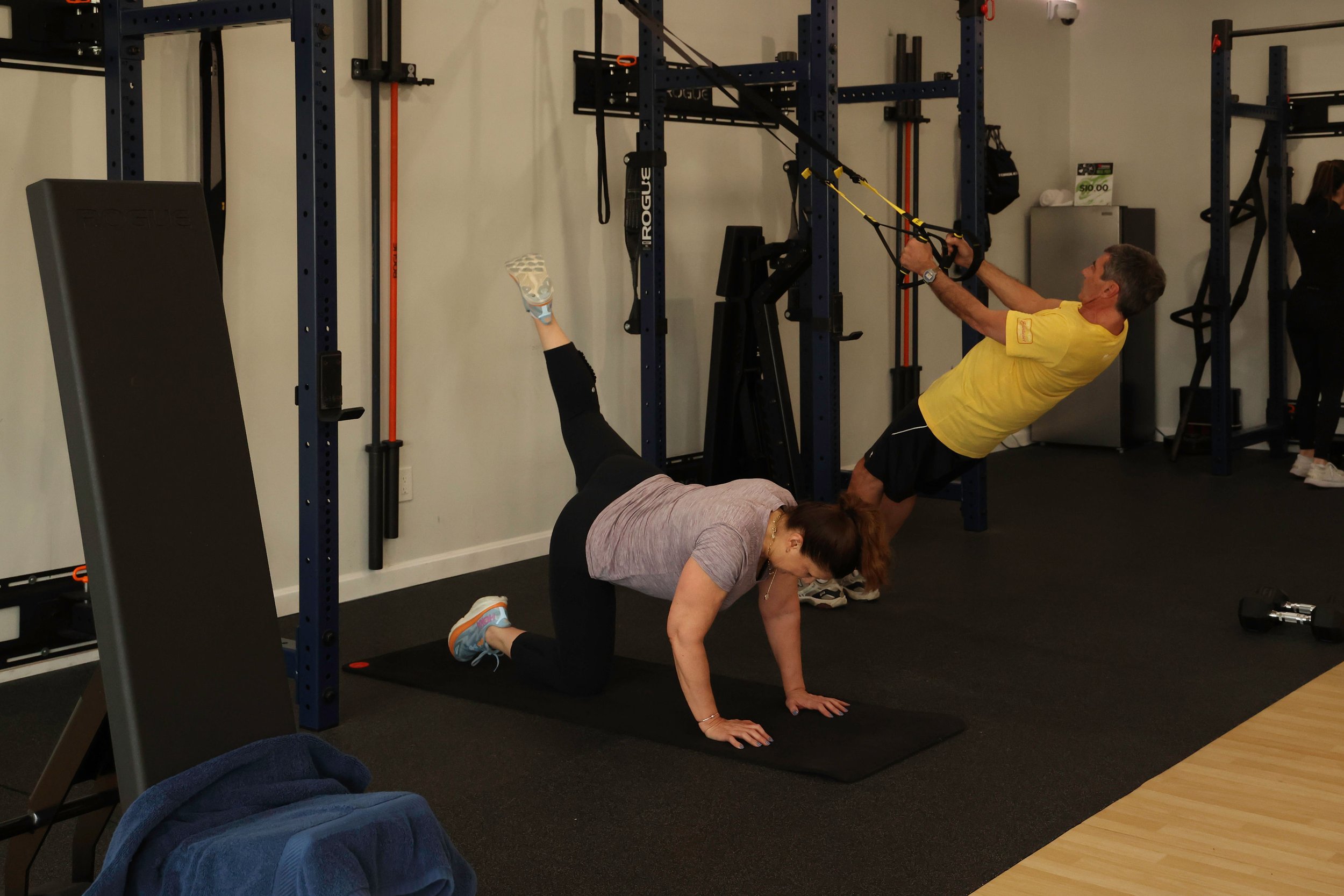 Multiple clients training Semi-private personal training at the same time with different workouts