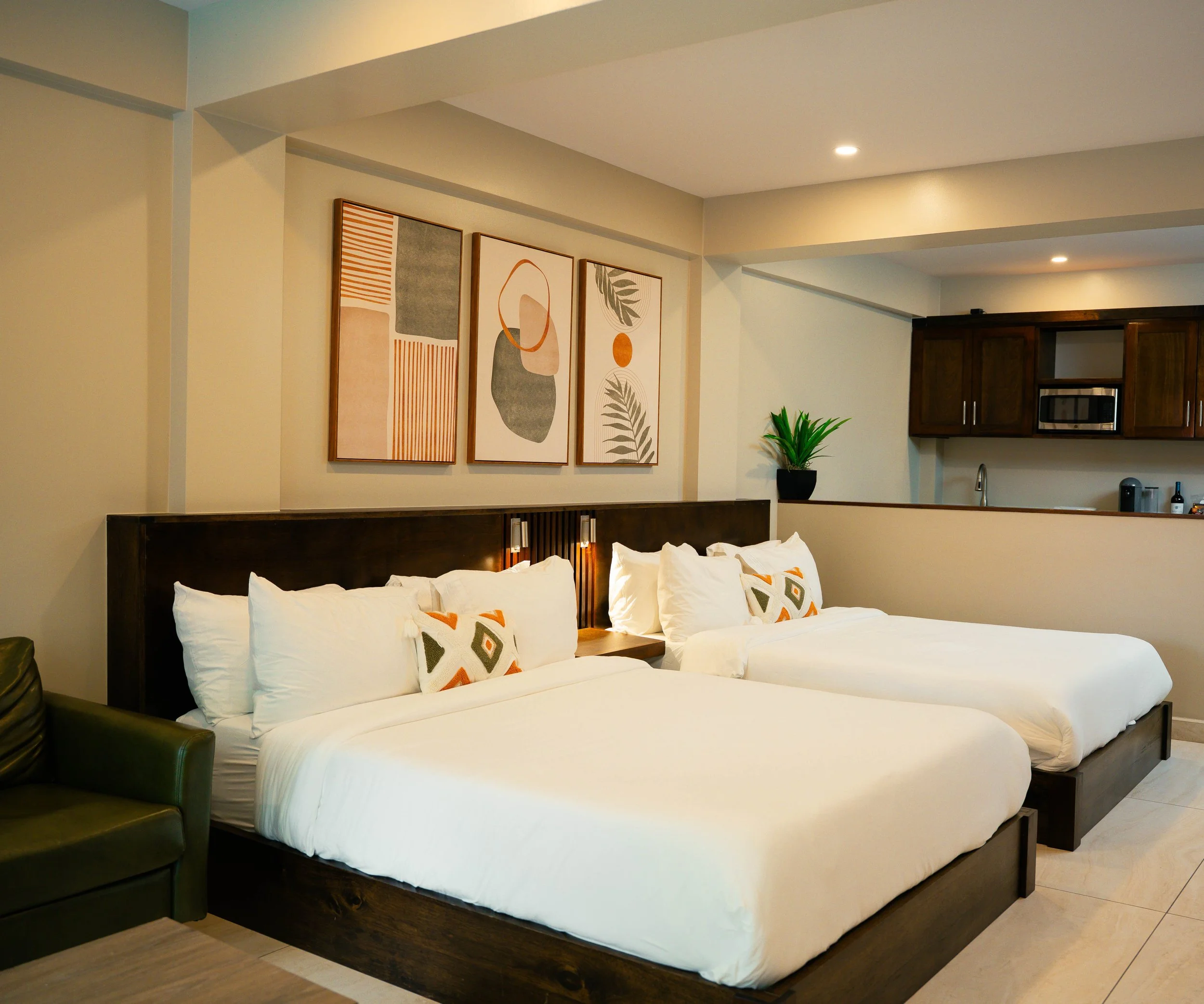 Double Queen Suite pool-view balcony — The Palms Kings Park Belize City