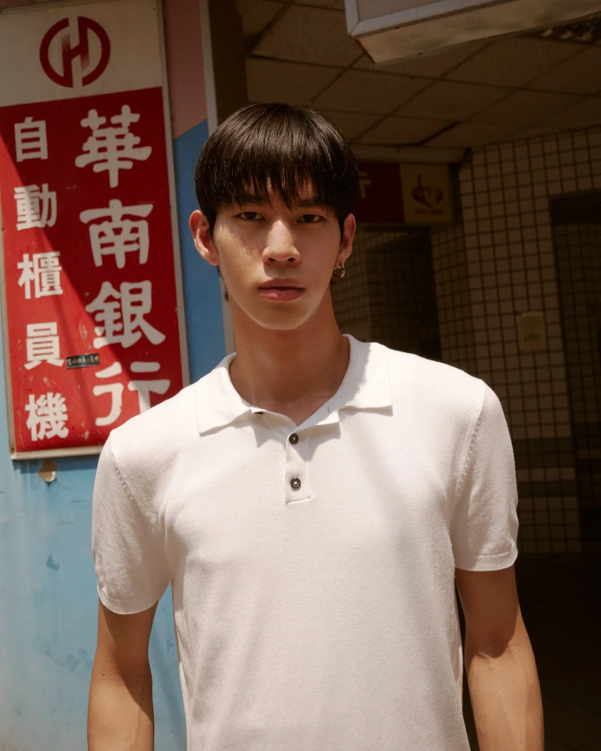 Male model photographed in a Taipei street setting for a fashion editorial by Pedro Márnez