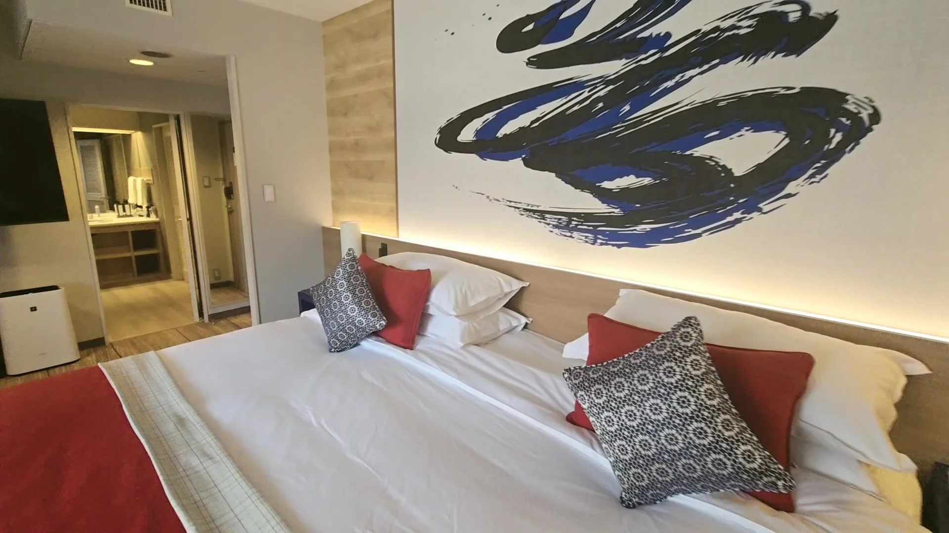 Superior room at Club Med Kiroro Peak with king bed and calligraphy wall art