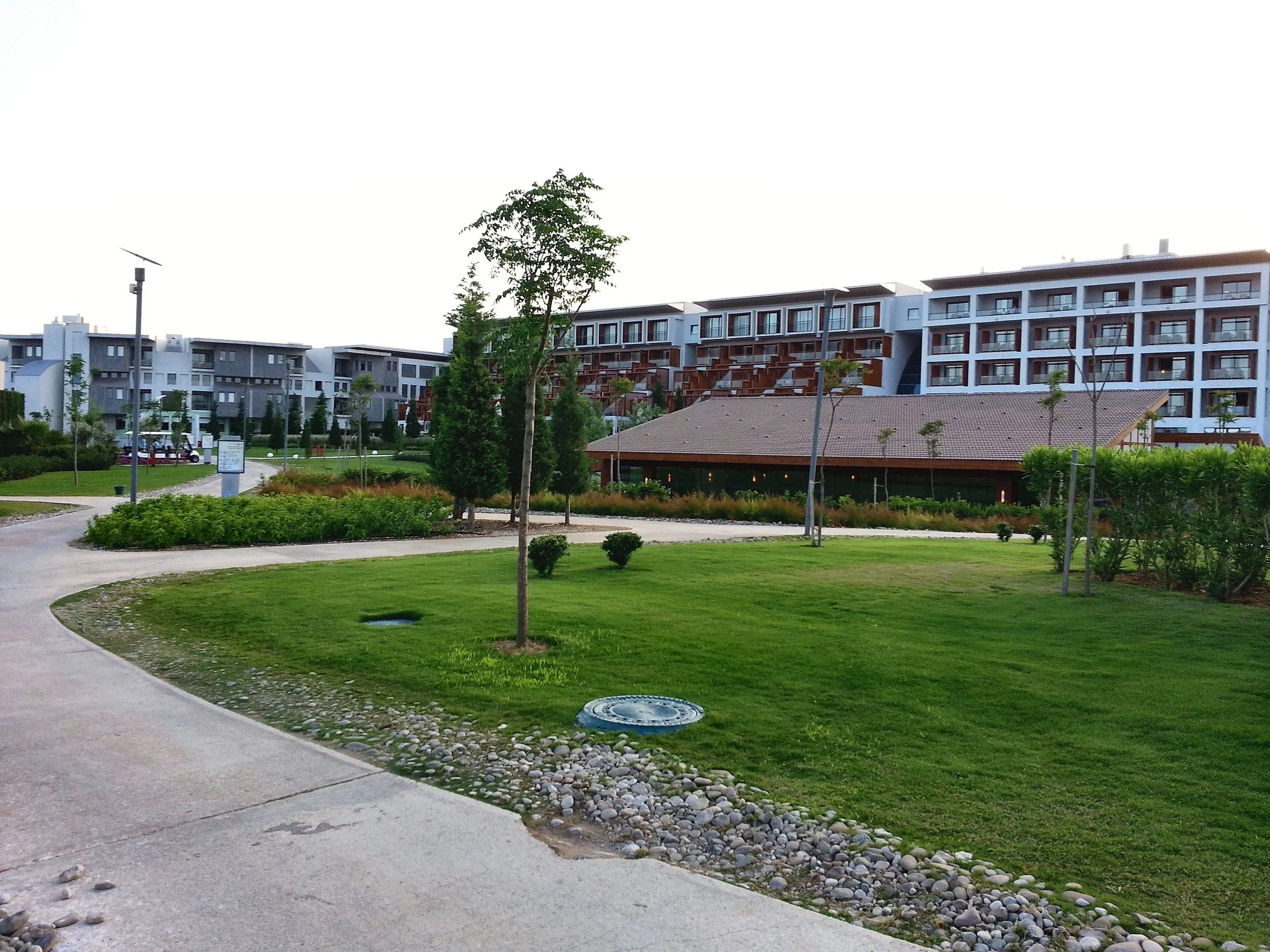 Lawns and paths in front of the accommodation blocks of the Club Med Belek
