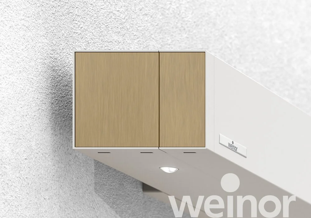 White ceiling mounted air ventilation unit with wooden panels and a small built-in light, branded 'weinoR'