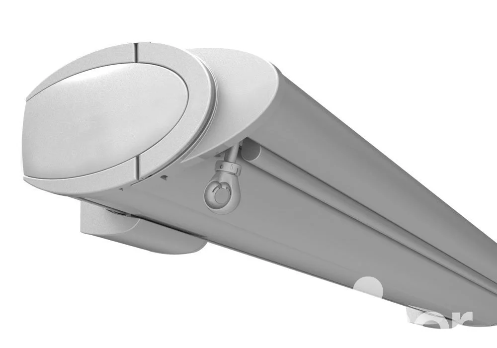 Close-up of a white retractable projector screen rolled up.