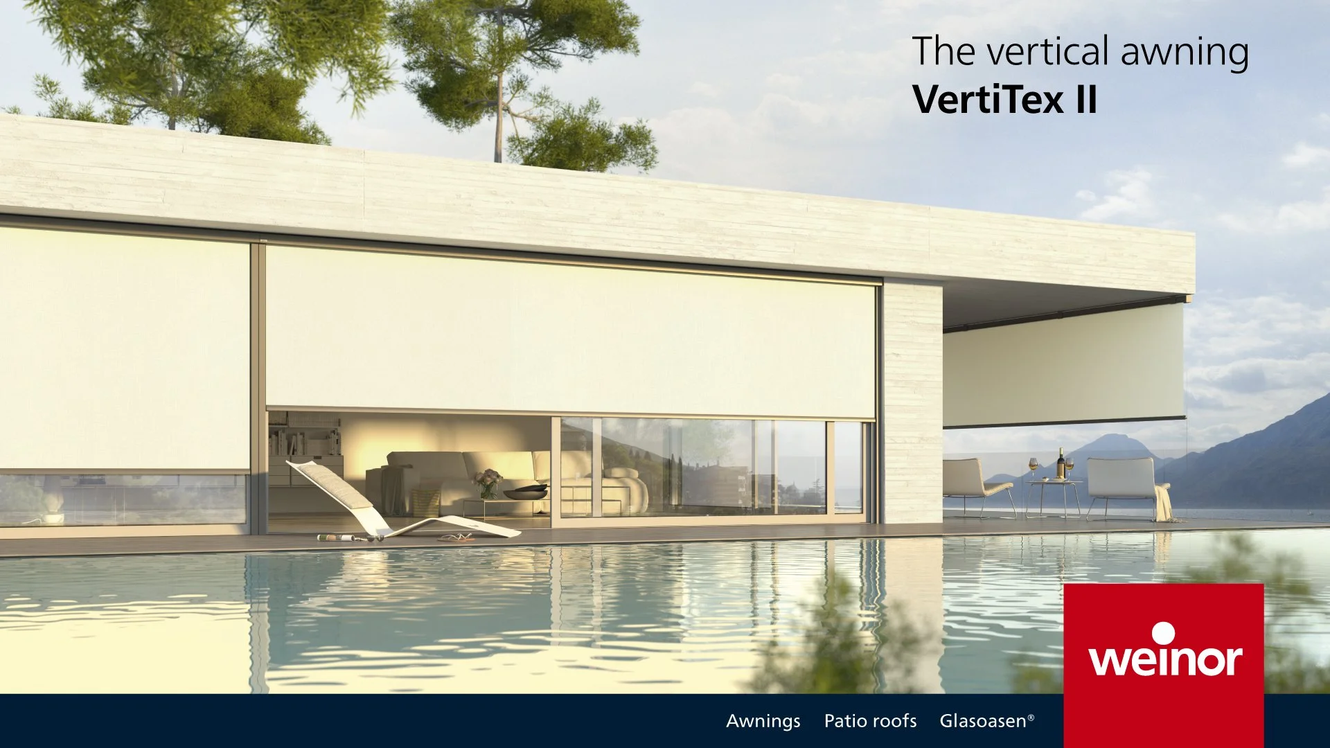 Modern house with vertical awning called VartiTex II, large glass sliding doors showing a living room inside, outdoor seating area, and pool with mountain view in the background.