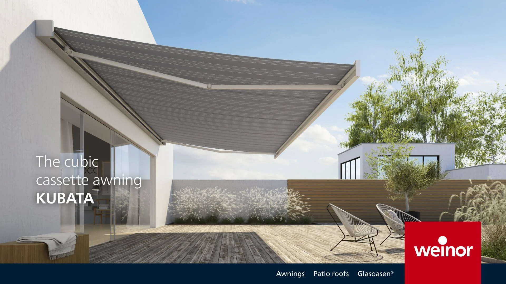 Modern outdoor deck area with gray cubic cassette awning extended over seating area and plants, under a blue sky.