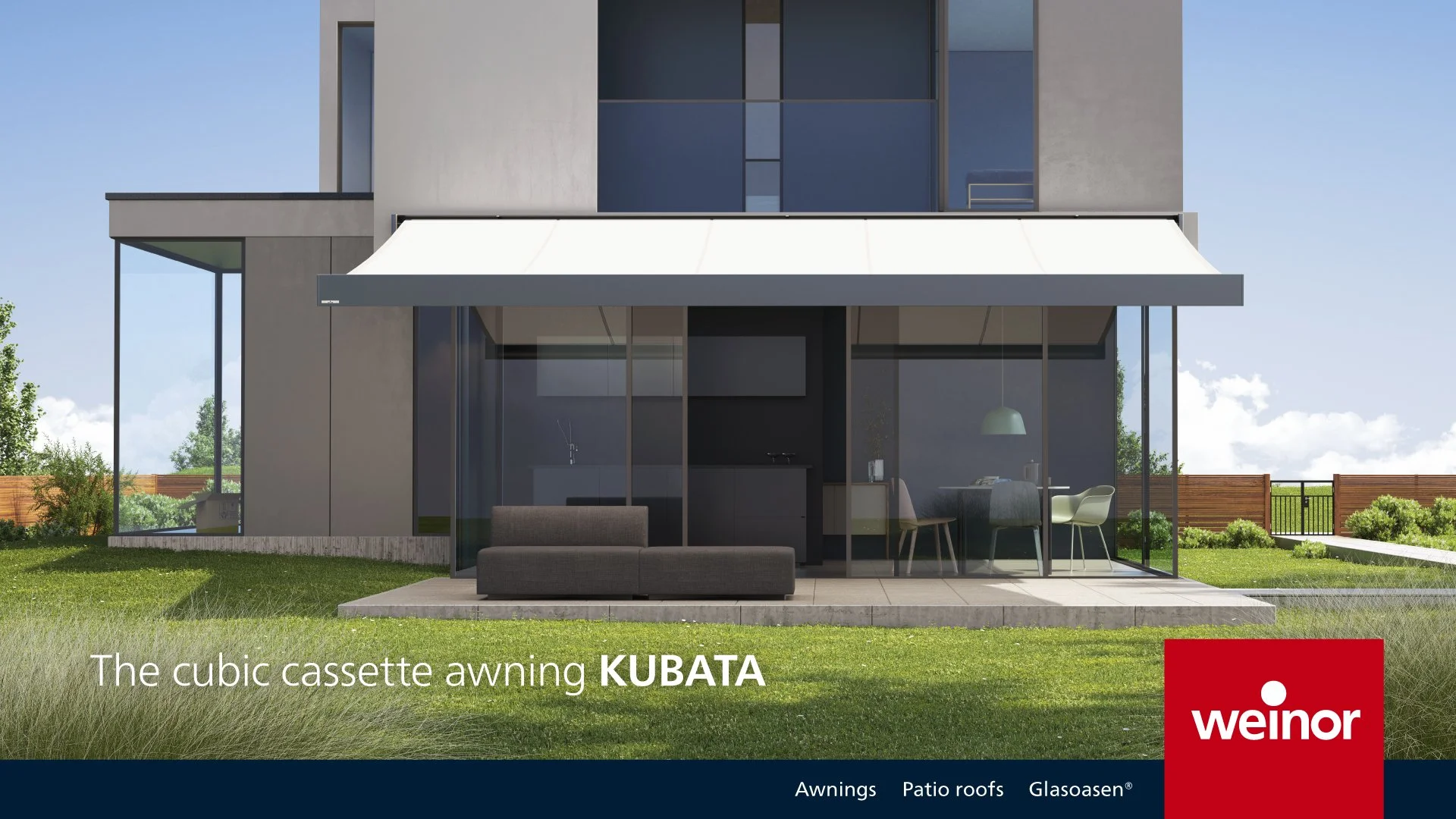 Modern house with glass walls and a cubic cassette awning labeled 'KUBATA' by weinor, with outdoor patio furniture and a green lawn.