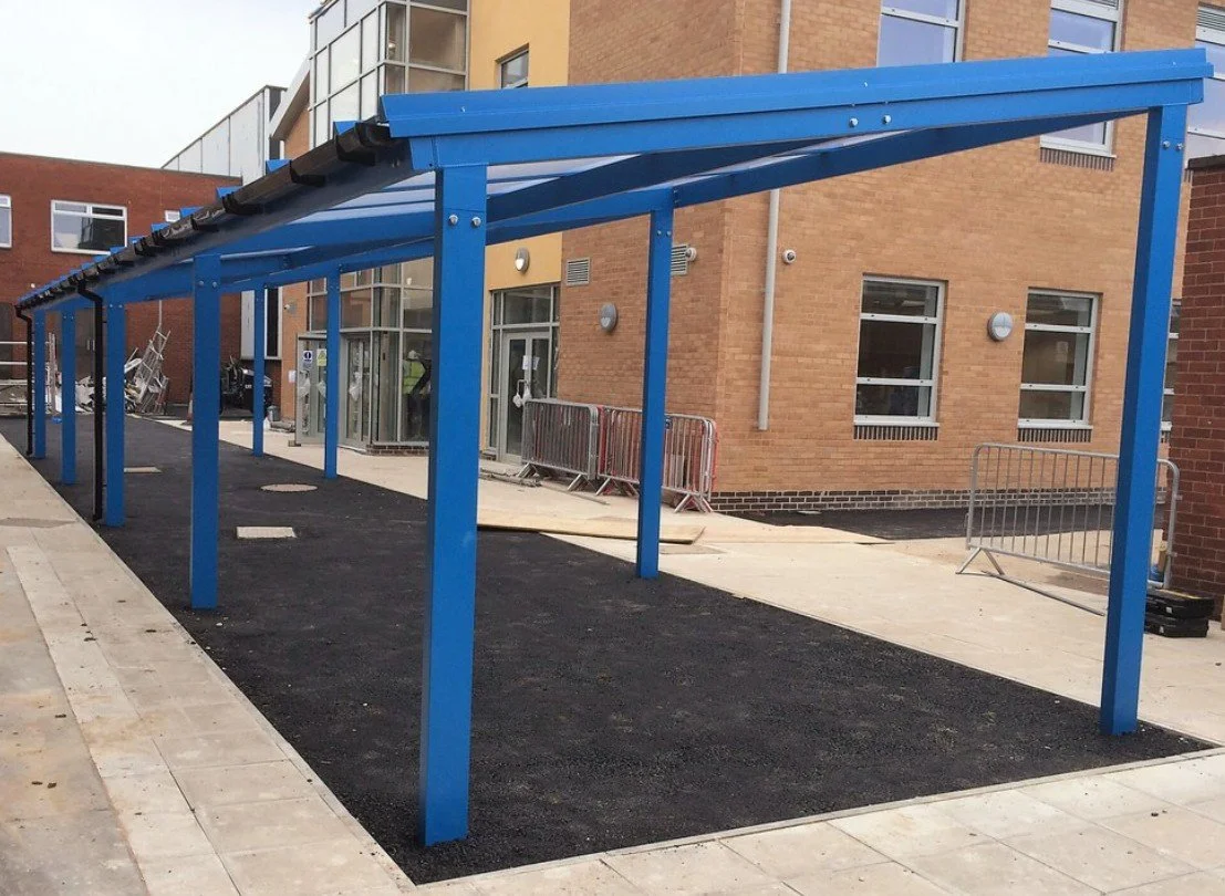 Polycarbonate Canopies - Robust School Canopy with an angled roof ...