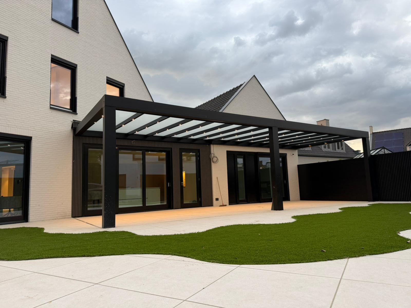 Modern glass veranda attached to a contemporary home."