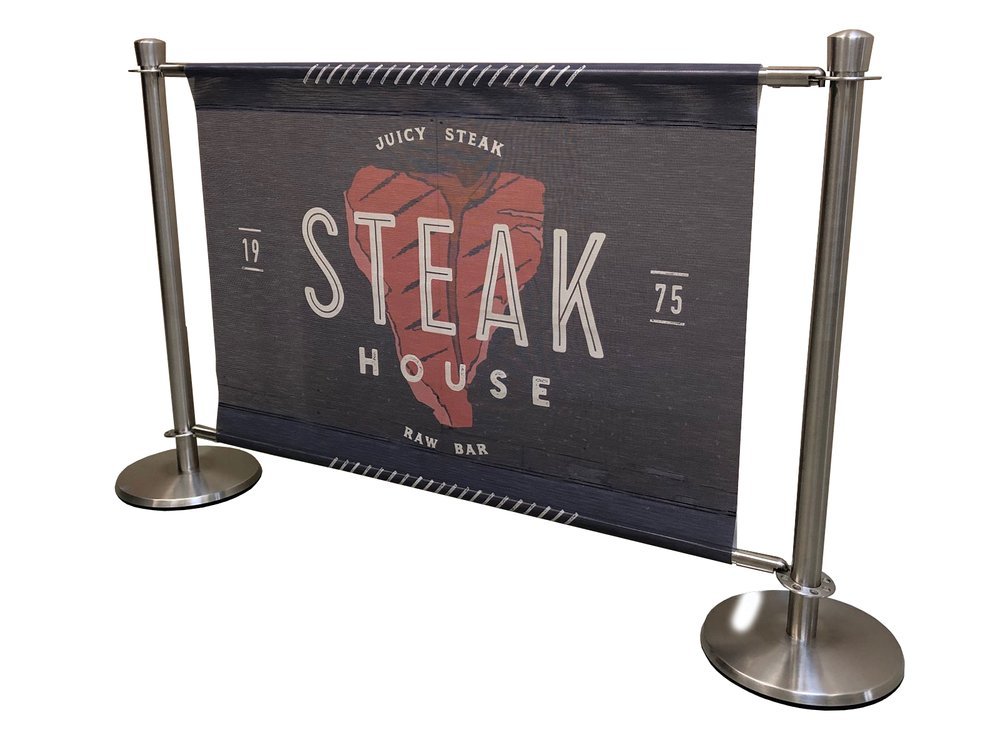 Freestanding fabric banner with a metal frame displaying the logo 'Steak House' and an image of a steak.