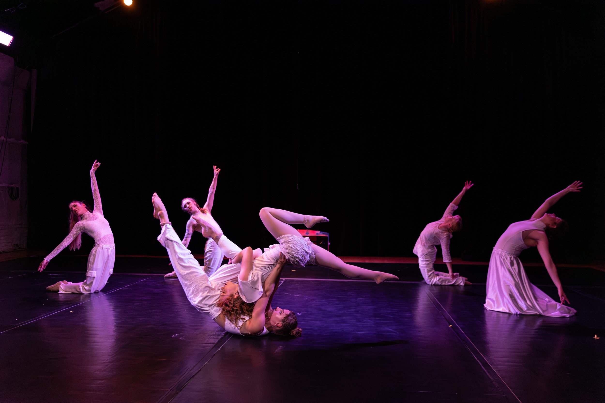 Sadie and Clare counterbalance while group backbends on knees.